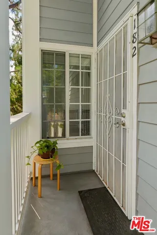 a bench sitting in front of a door