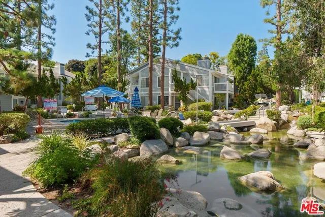 a view of swimming pool with outdoor seating