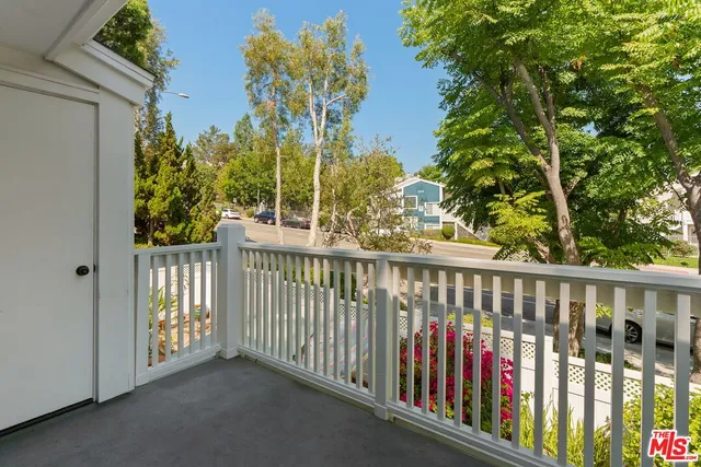 a view of a balcony with swing plants