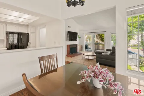 a living room with furniture fireplace and flat screen tv