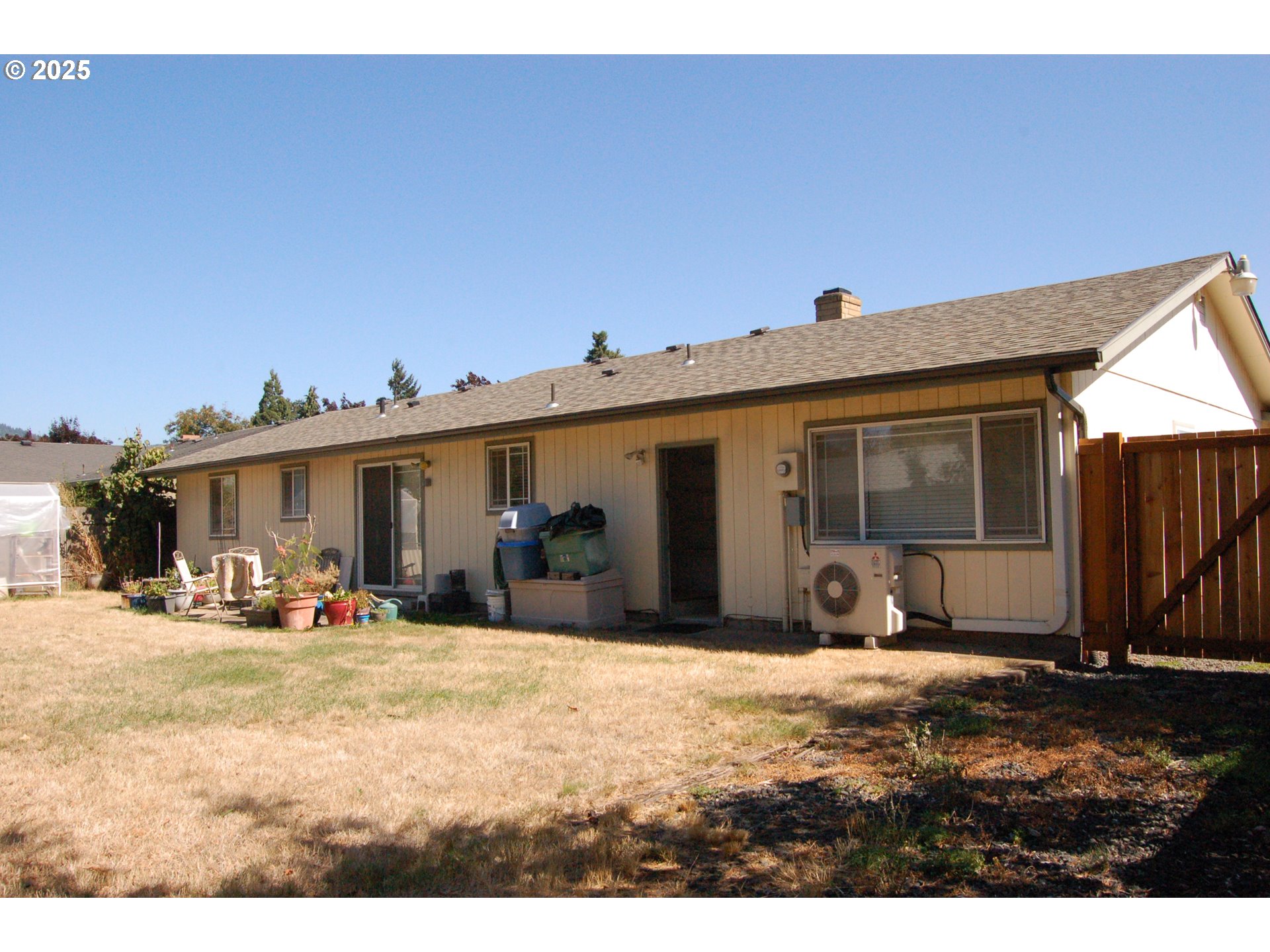 2252 Rose Blossom Drive Springfield, OR 97477 - Photo 16 of 26 a view of a house with chairs in front of house