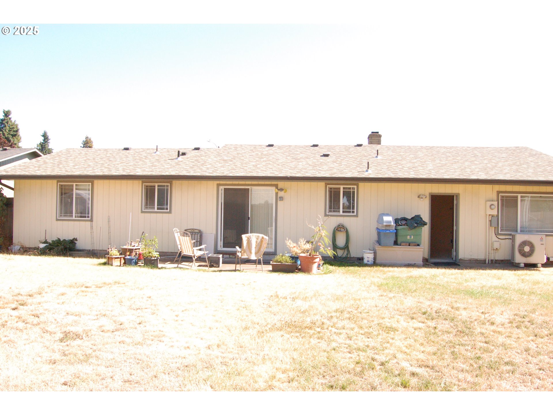 2252 Rose Blossom Drive Springfield, OR 97477 - Photo 18 of 26 a view of a house with snow on the ground and covered with tall trees