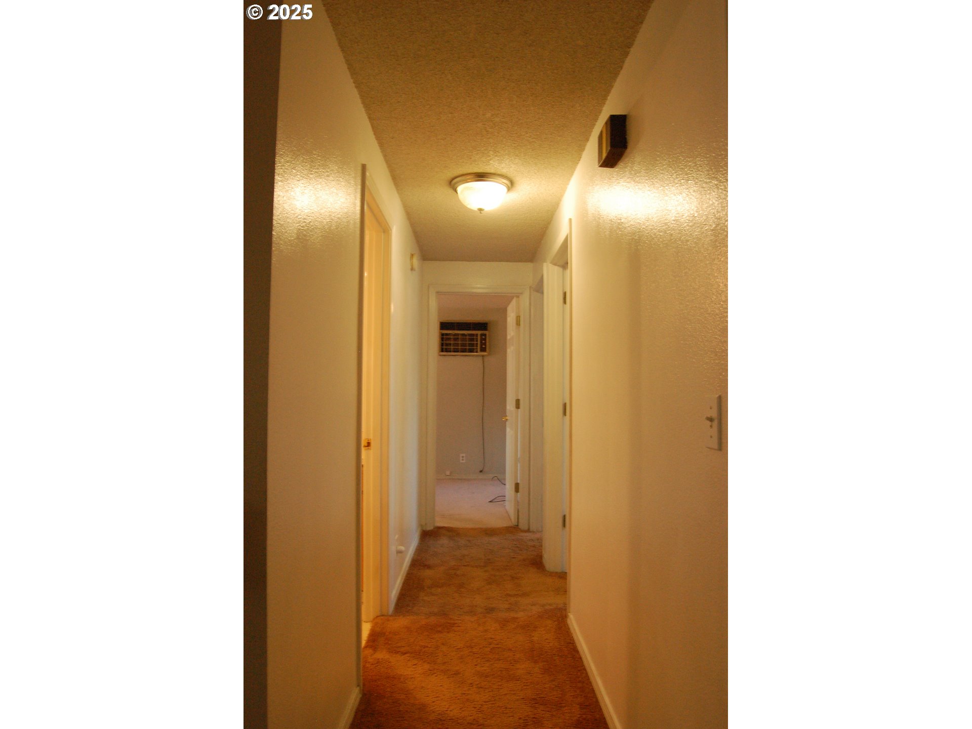 2252 Rose Blossom Drive Springfield, OR 97477 - Photo 20 of 26 a view of a hallway with wooden floor
