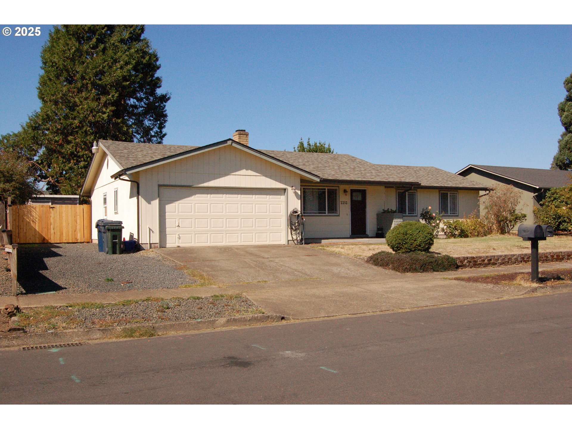 2252 Rose Blossom Drive Springfield, OR 97477 - Photo 2 of 26 a view of a house with a yard