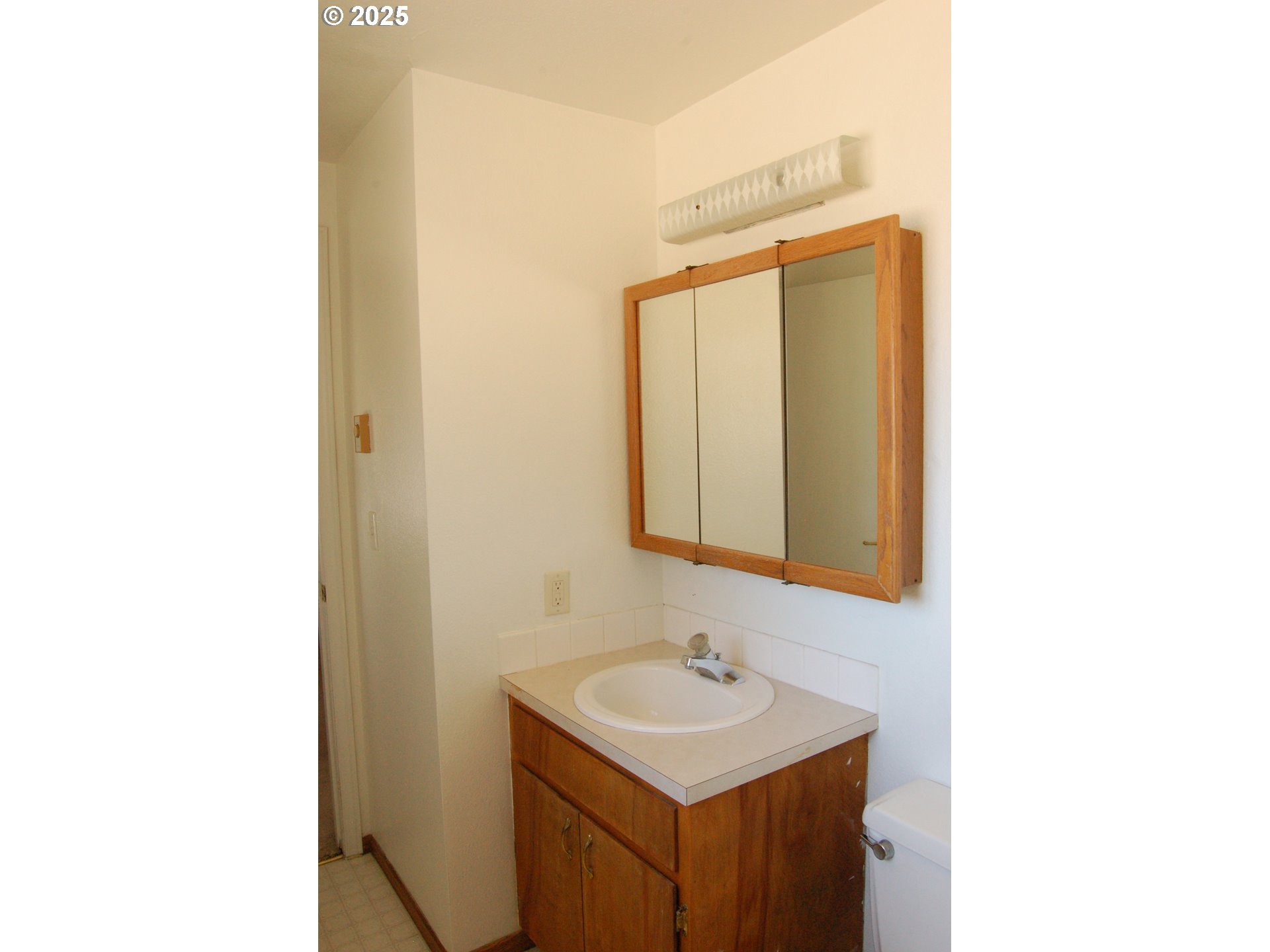 2252 Rose Blossom Drive Springfield, OR 97477 - Photo 8 of 26 a bathroom with a sink and a mirror