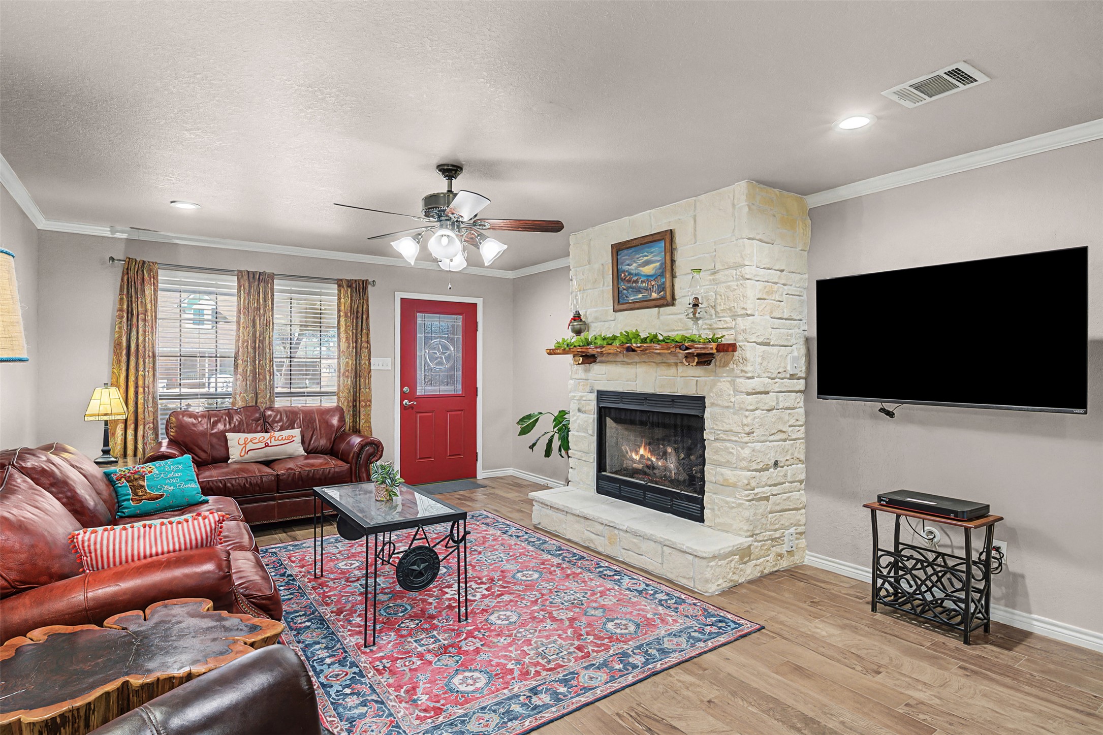 1601 Sunset Circle Cameron, TX 76520 - Photo 7 of 40 Spacious living room with stone fireplace