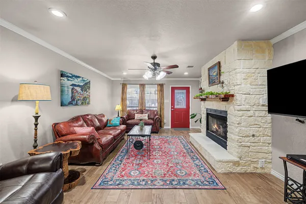 a living room with furniture and a fireplace
