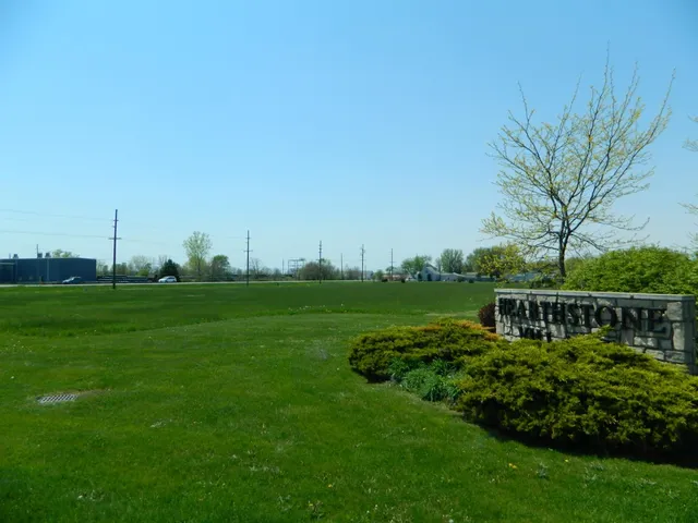 a view of a house with a big yard
