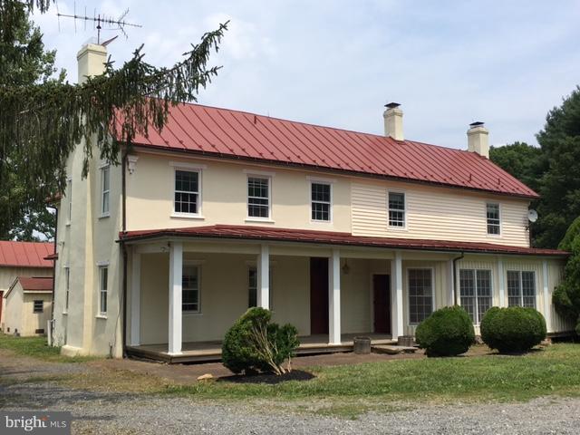 20852 St Louis Road Middleburg, VA 20117 - Photo 1 of 29 a front view of a house with garden