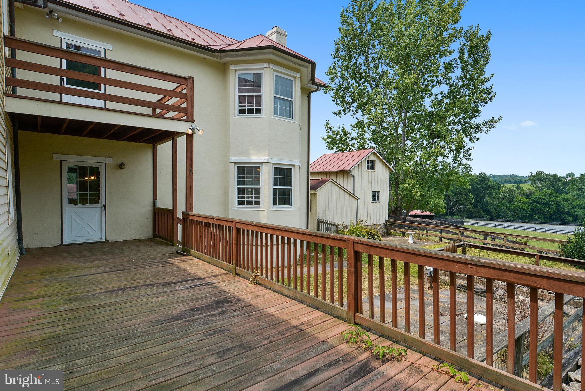 20852 St Louis Road Middleburg, VA 20117 - Photo 8 of 29 a view of a house with a balcony