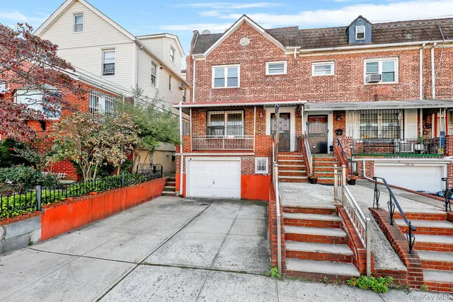 a front view of a house with lots of green space