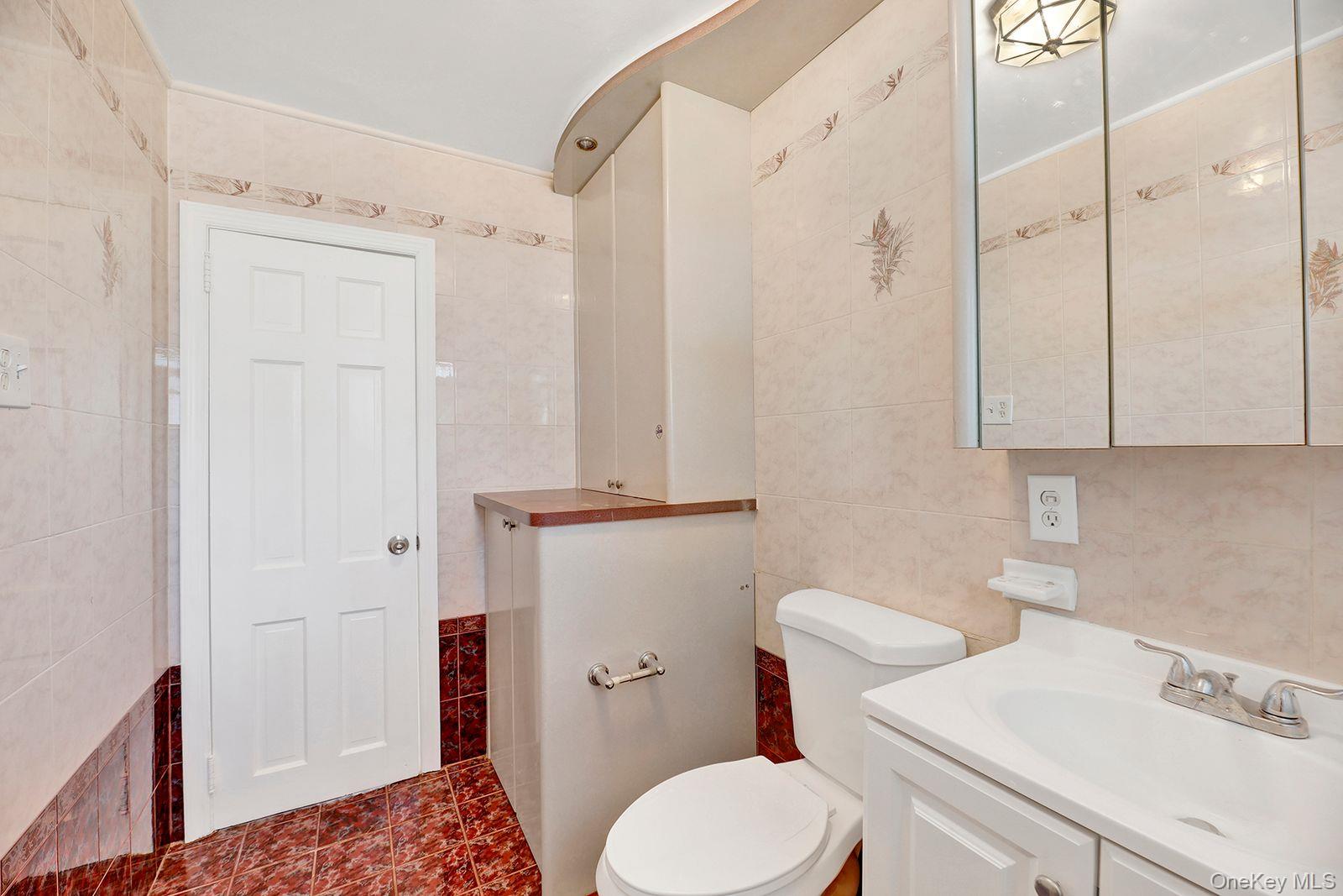 102-12 62nd Road Queens, NY 11375 - Photo 18 of 27 a bathroom with a sink a toilet and shower