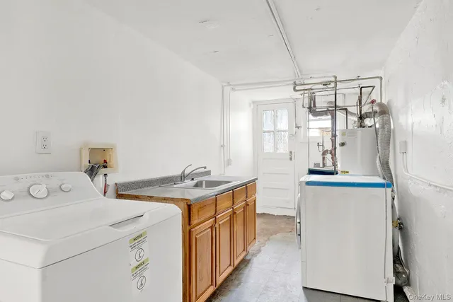 a utility room with dryer and washer