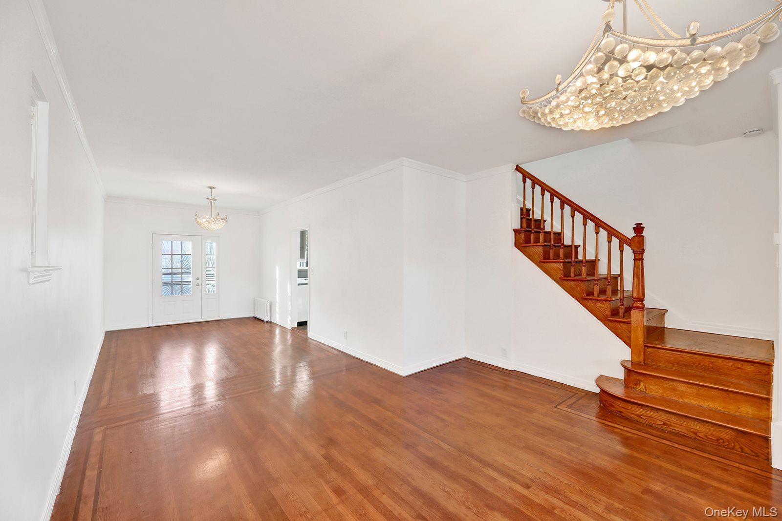 102-12 62nd Road Queens, NY 11375 - Photo 6 of 27 a view of an entryway with wooden floor