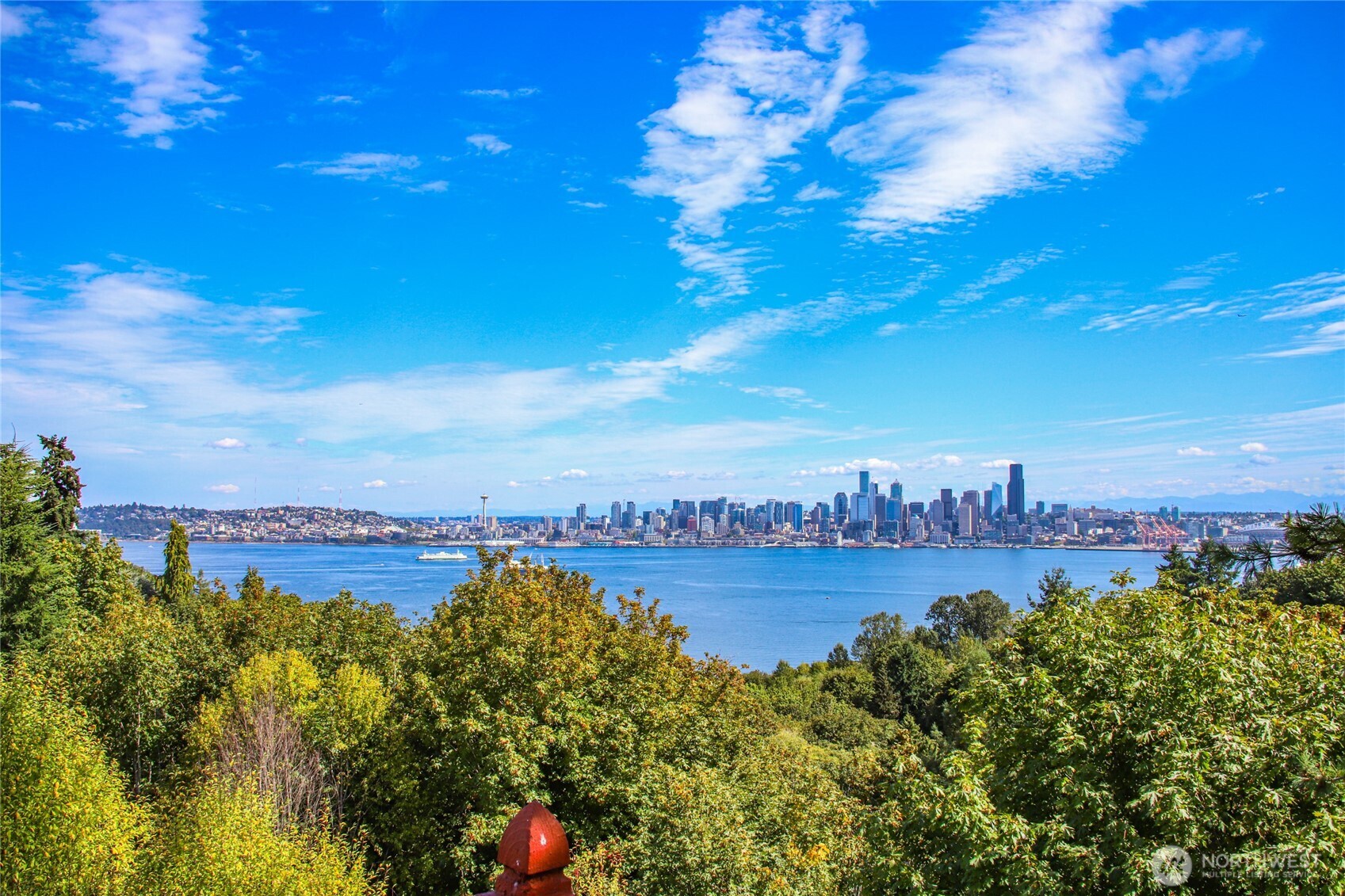 2309 Arch Avenue Southwest Seattle, WA 98116 - Photo 1 of 40 a view of a city with lots of residential buildings ocean and mountain in the back