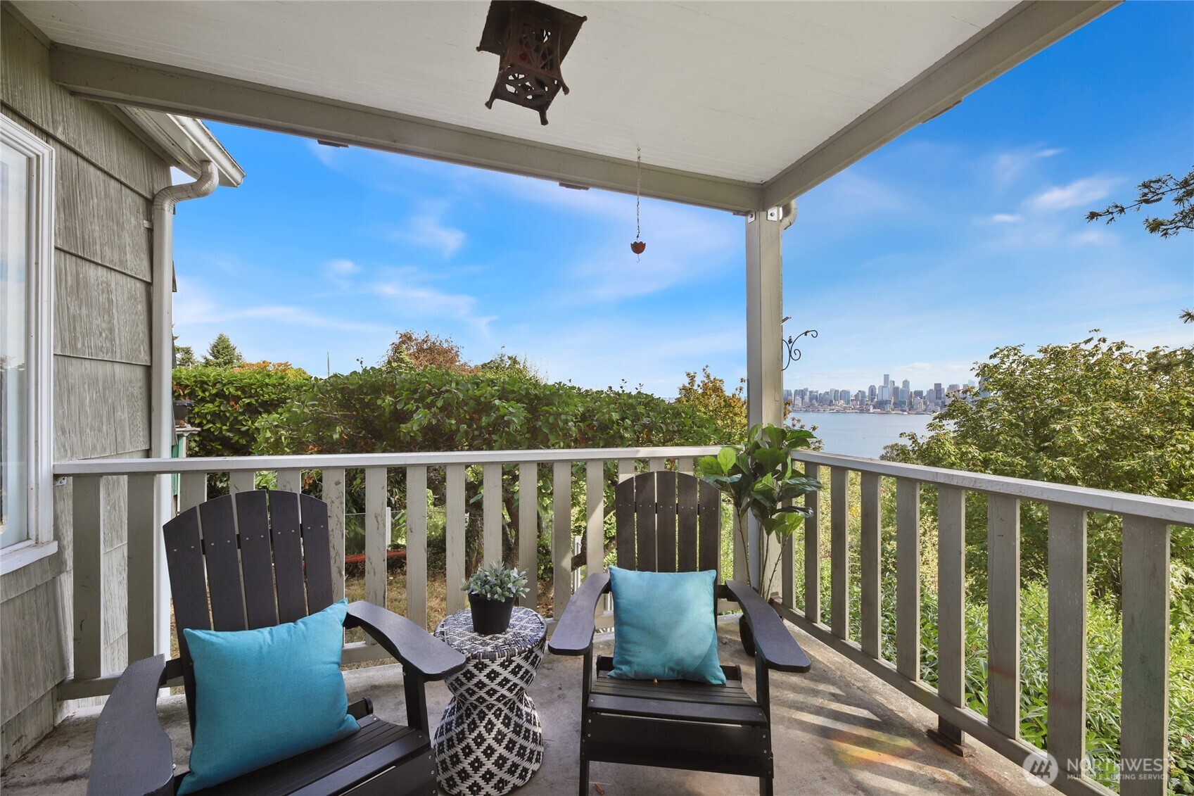 2309 Arch Avenue Southwest Seattle, WA 98116 - Photo 12 of 40 a balcony with wooden floor and outdoor seating