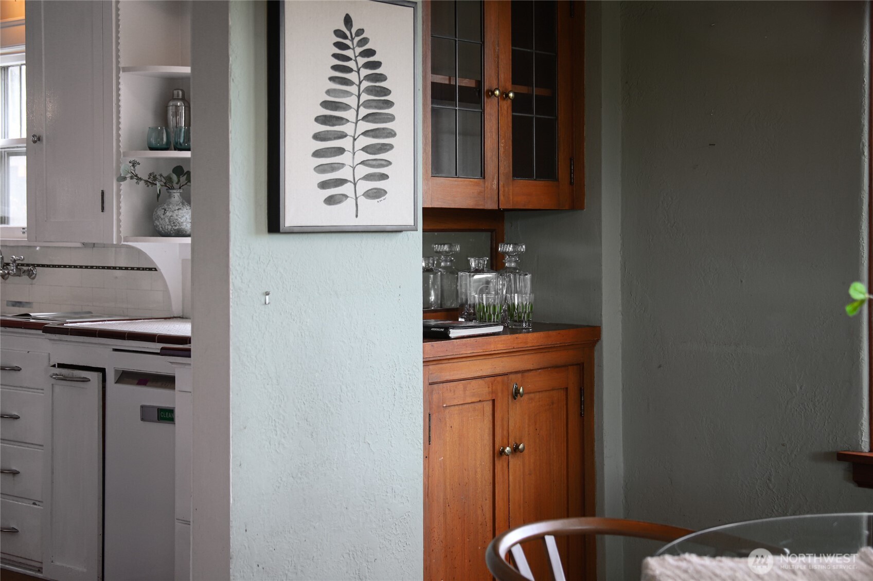 2309 Arch Avenue Southwest Seattle, WA 98116 - Photo 15 of 40 a kitchen with a refrigerator and cabinets