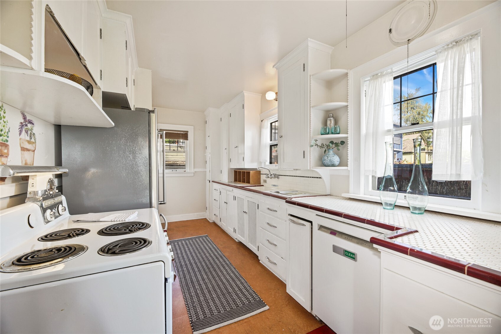 2309 Arch Avenue Southwest Seattle, WA 98116 - Photo 16 of 40 a kitchen with a stove and a sink
