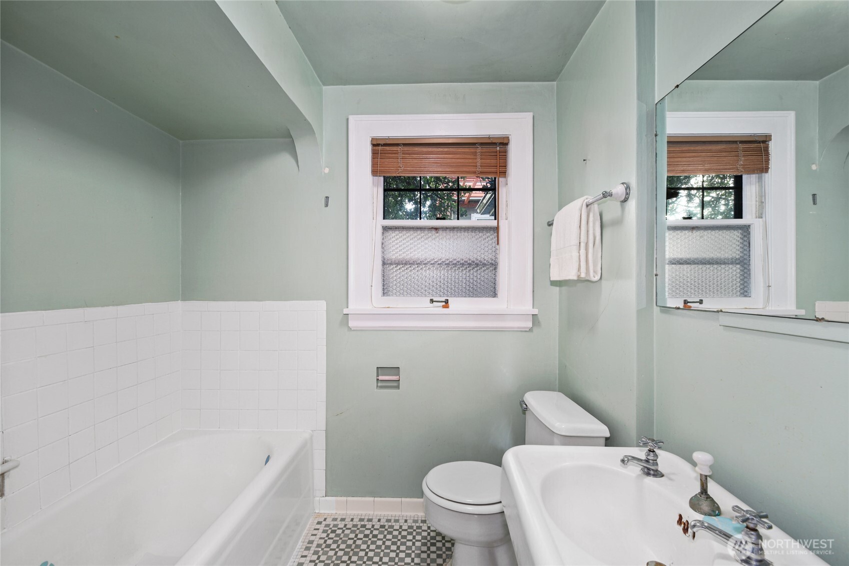 2309 Arch Avenue Southwest Seattle, WA 98116 - Photo 19 of 40 a bathroom with a sink and a bathtub