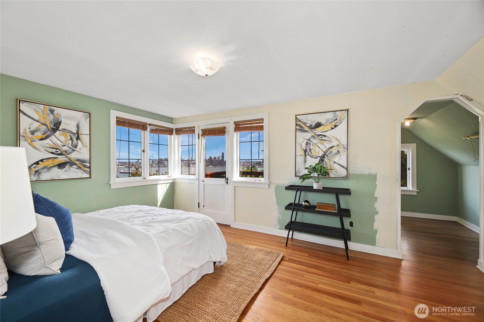 2309 Arch Avenue Southwest Seattle, WA 98116 - Photo 20 of 40 a bedroom with a bed and wooden floor