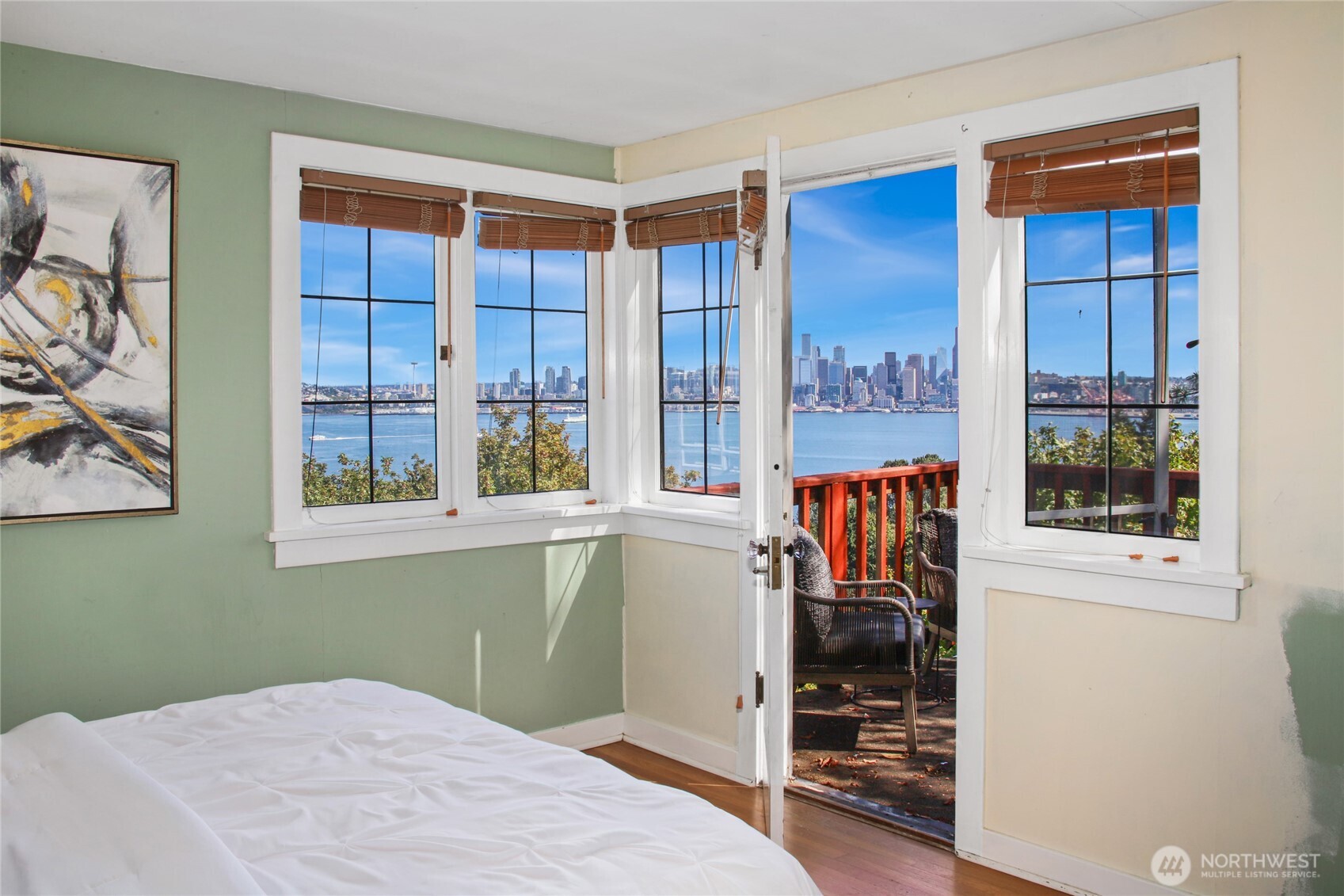 2309 Arch Avenue Southwest Seattle, WA 98116 - Photo 21 of 40 a view of a bedroom with wooden floor and windows