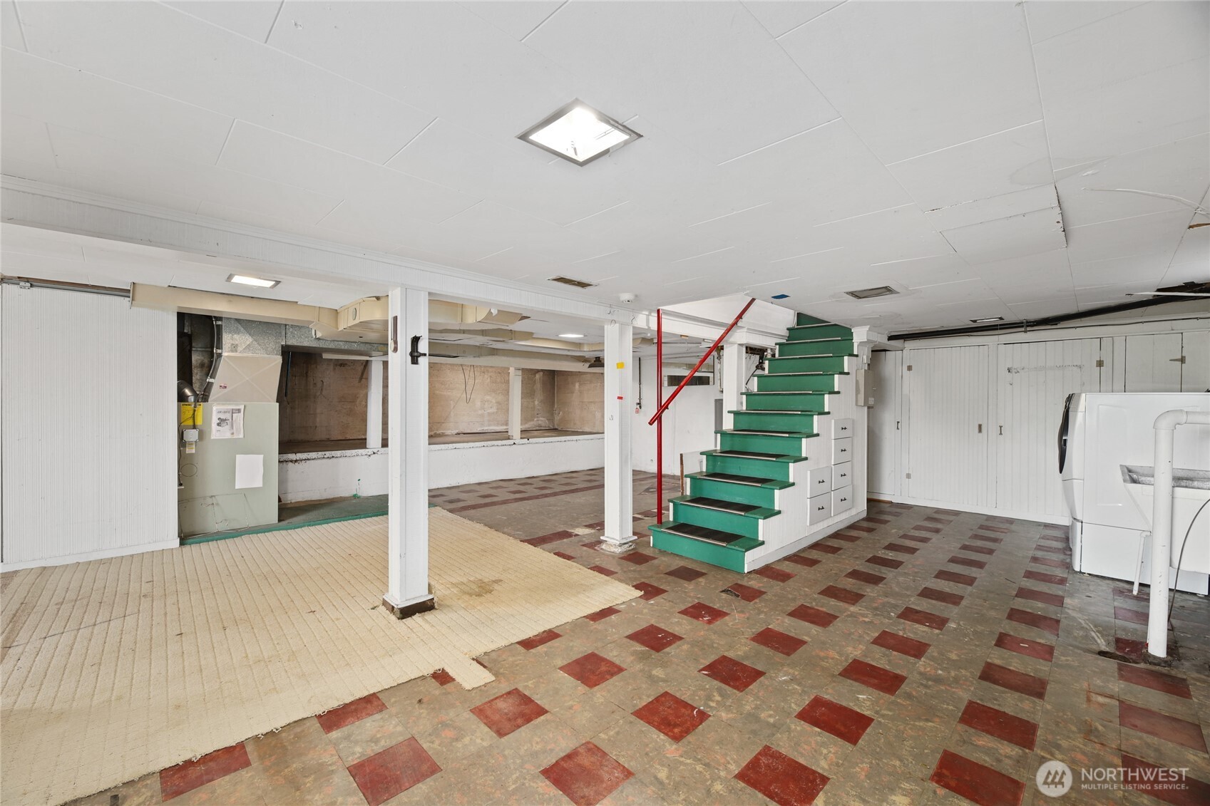 2309 Arch Avenue Southwest Seattle, WA 98116 - Photo 30 of 40 a view of a livingroom with wooden floor and stairs