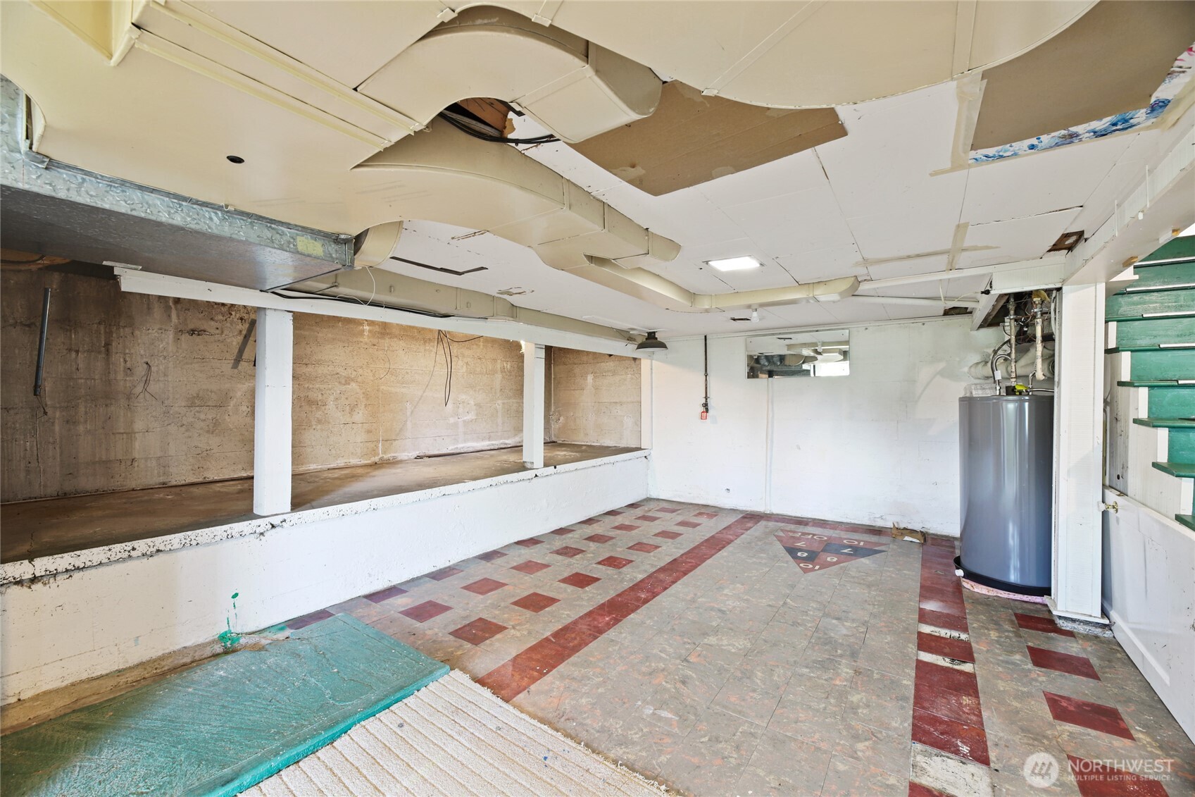 2309 Arch Avenue Southwest Seattle, WA 98116 - Photo 32 of 40 a bedroom with a bed and a large window