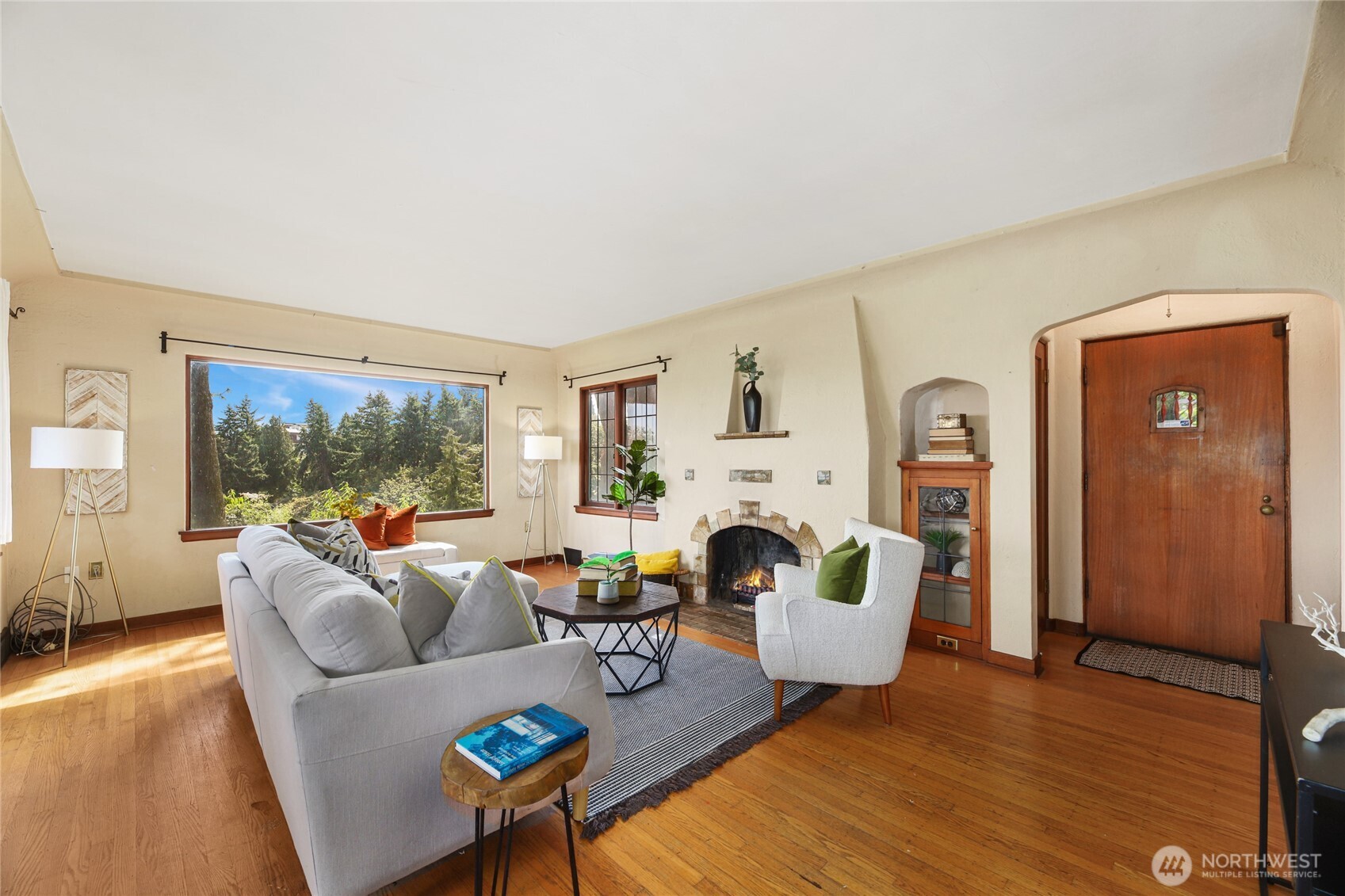 2309 Arch Avenue Southwest Seattle, WA 98116 - Photo 6 of 40 a living room with furniture and a fireplace