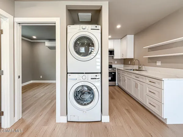 a kitchen with a stove top oven sink and cabinets