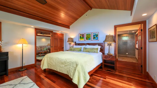 a bedroom with a bed and a lamp