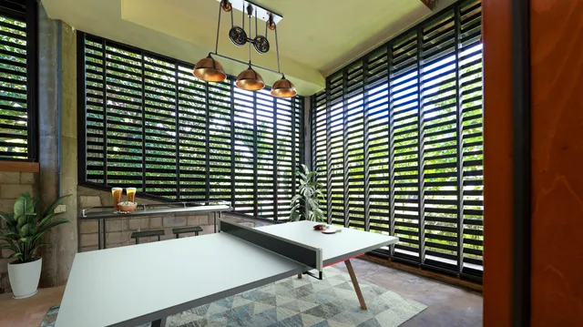 a balcony with table and chairs