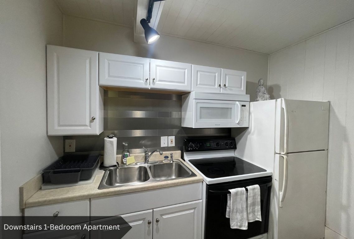 0 Rabb Road Austin, TX 78704 - Photo 29 of 39 a kitchen with stainless steel appliances a stove a refrigerator and a sink