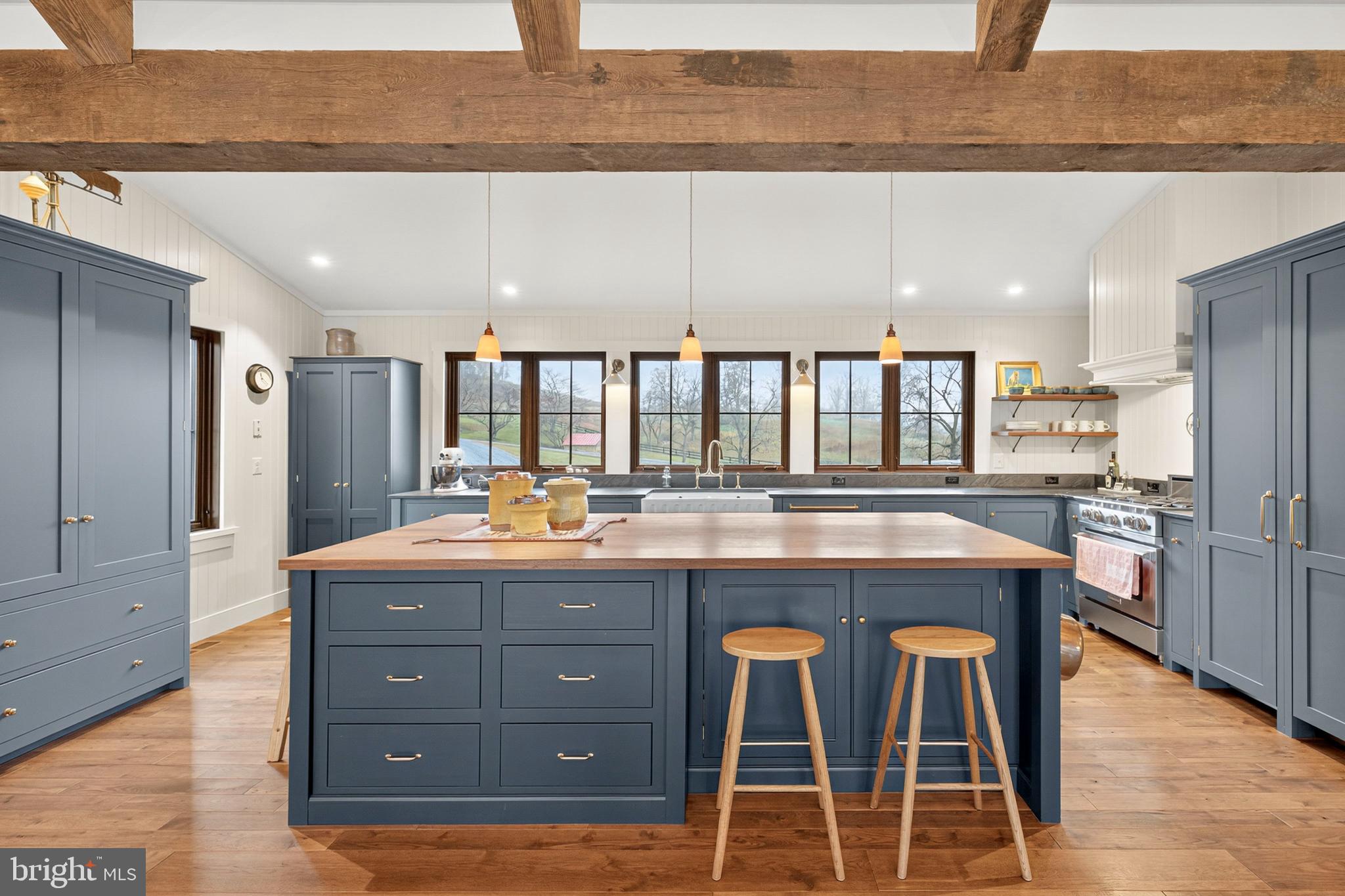 63 Riley Hollow Road Huntly, VA 22640 - Photo 23 of 92 a kitchen with stainless steel appliances kitchen island granite countertop a table chairs sink and cabinets