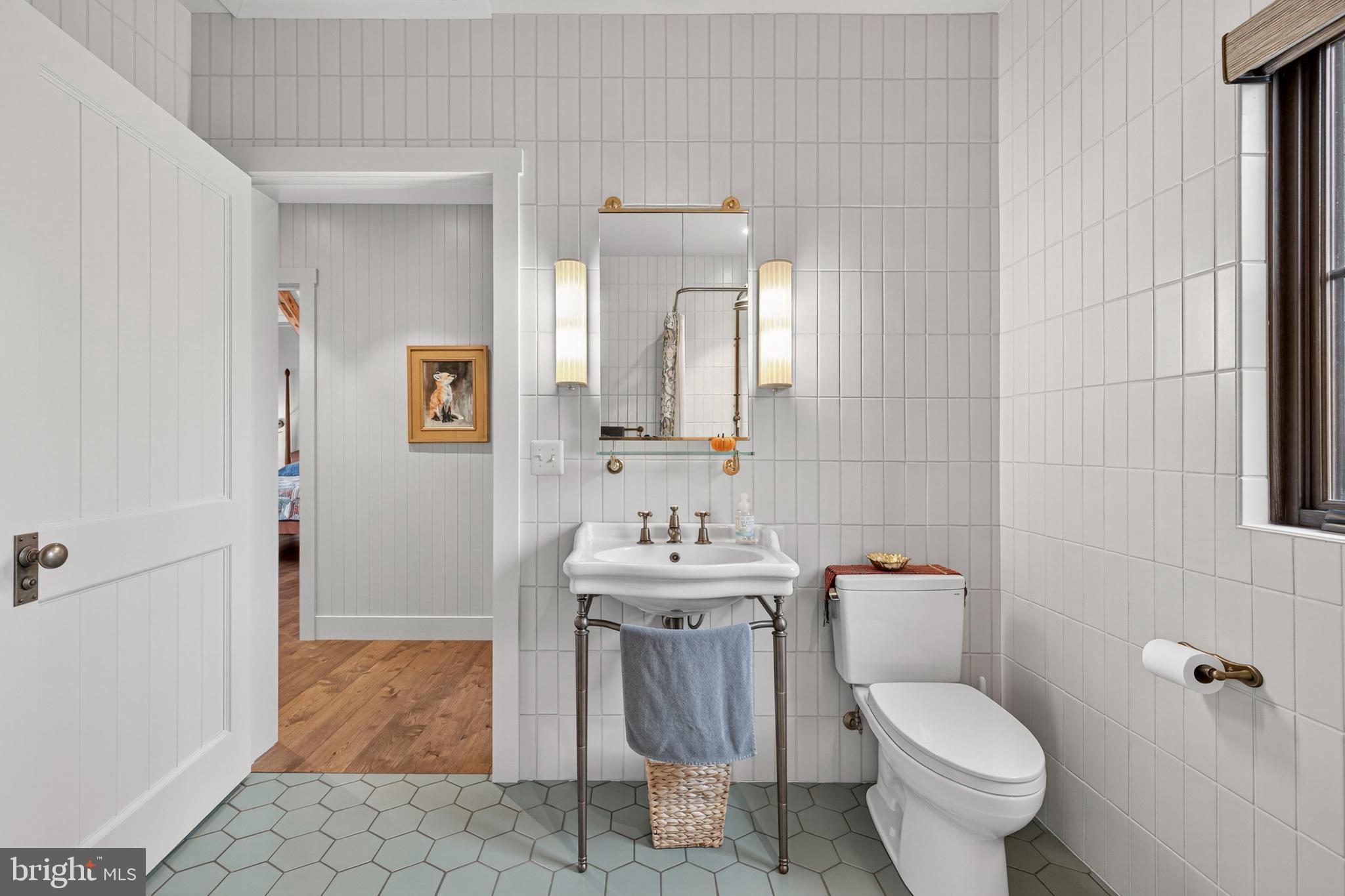 63 Riley Hollow Road Huntly, VA 22640 - Photo 24 of 92 a bathroom with a sink a toilet and mirror