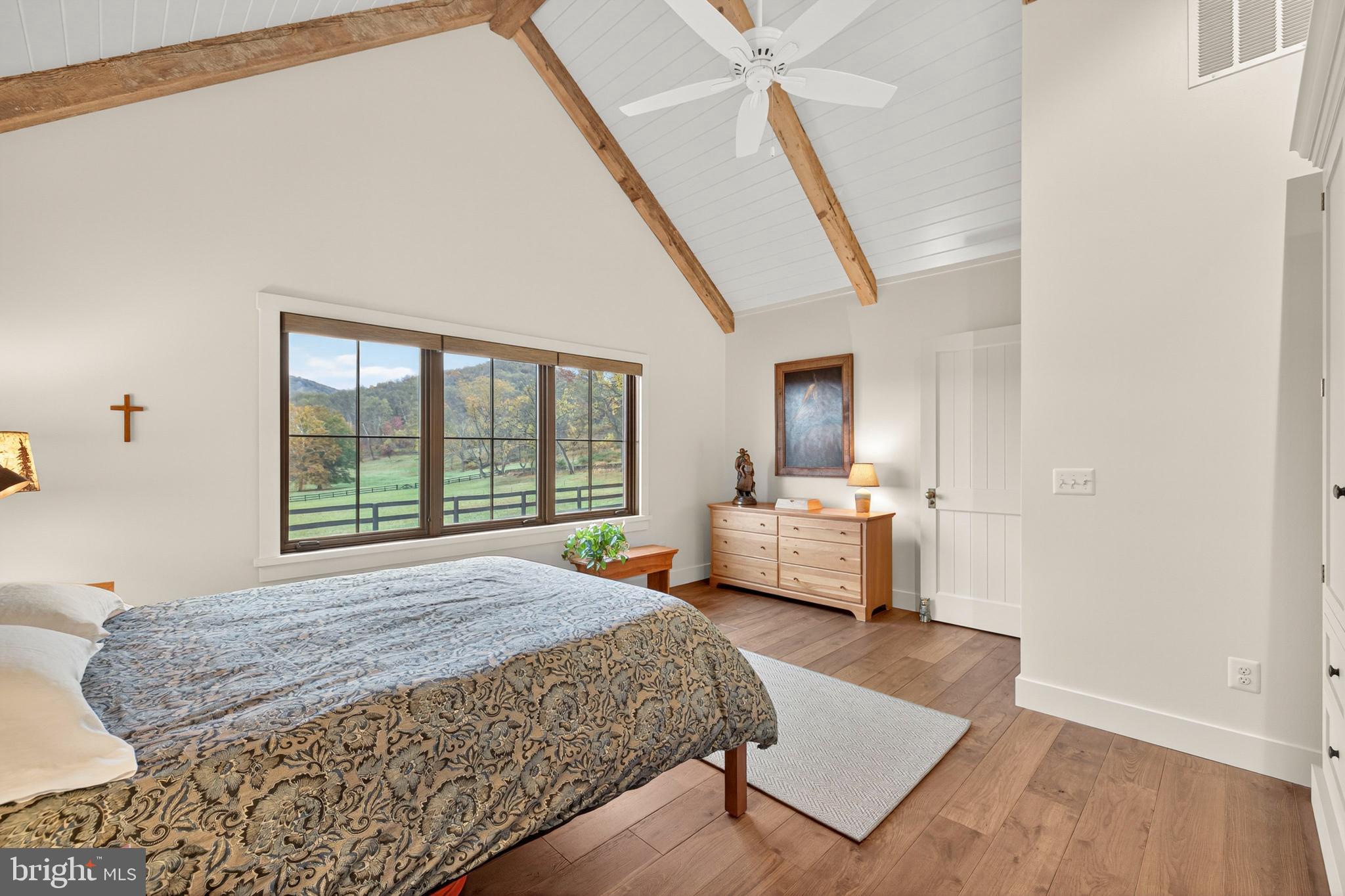63 Riley Hollow Road Huntly, VA 22640 - Photo 32 of 92 a bedroom with a bed and wooden floor