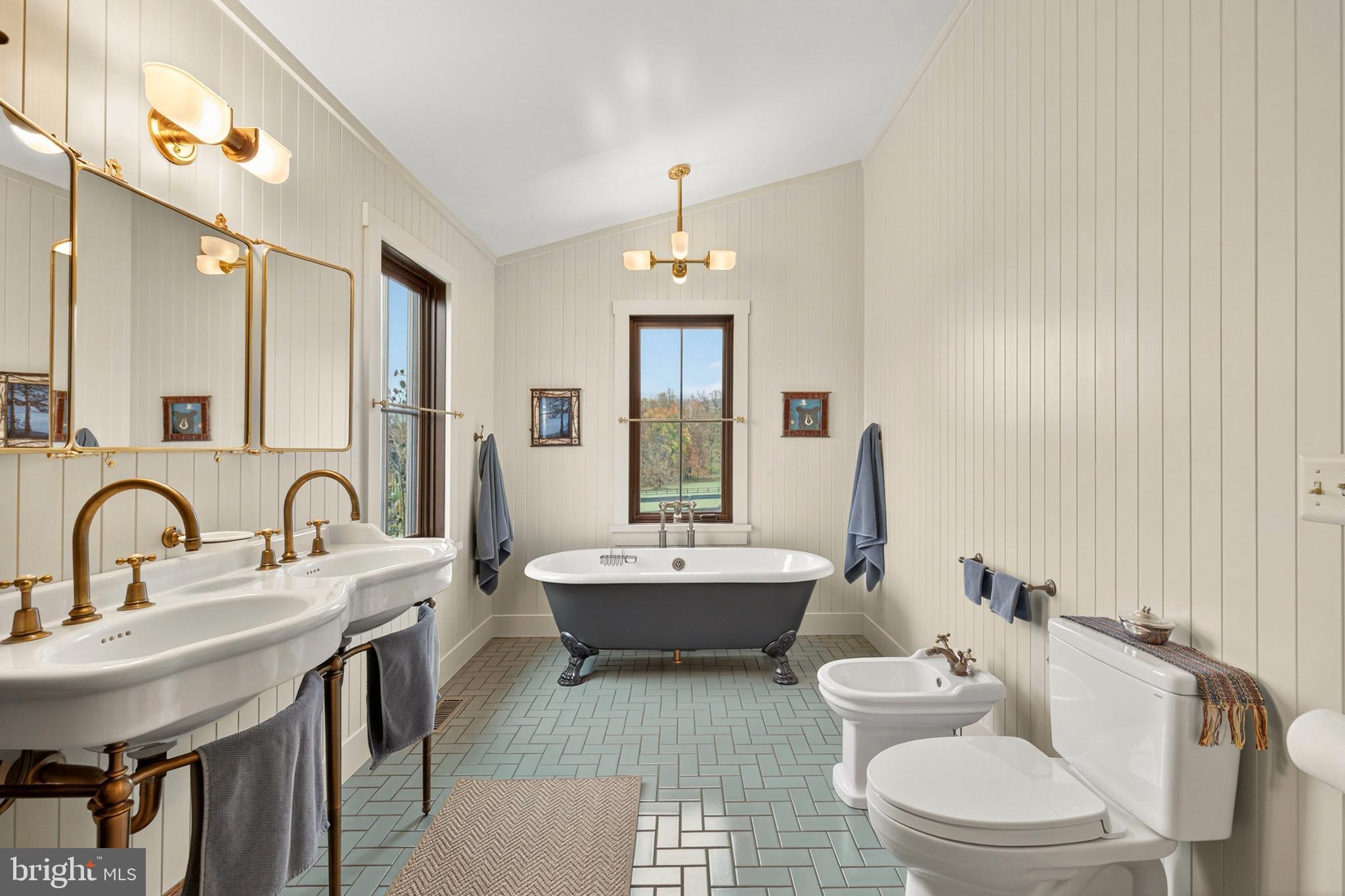 63 Riley Hollow Road Huntly, VA 22640 - Photo 33 of 92 a bathroom with a double vanity sink toilet mirror and bathtub