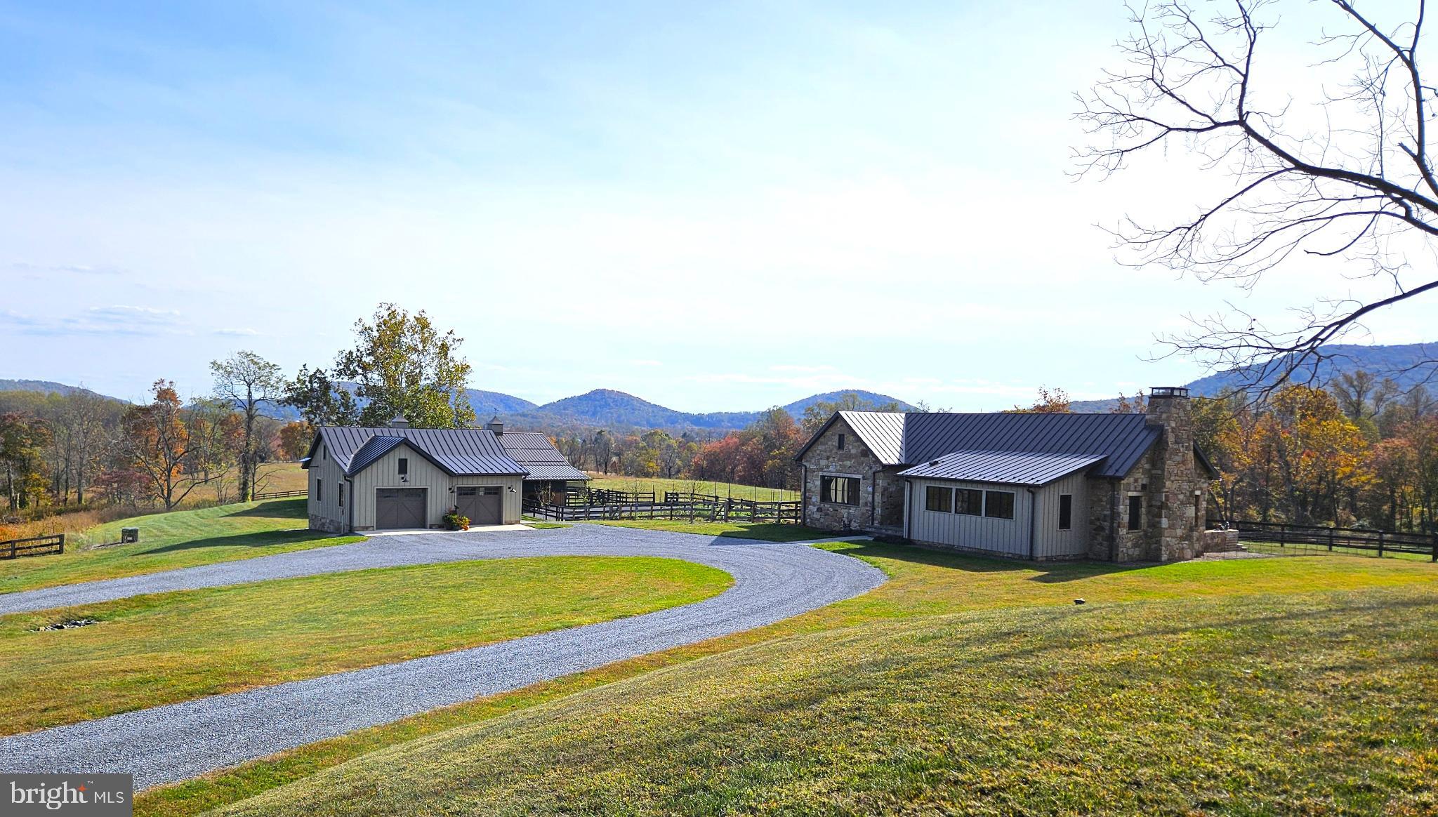63 Riley Hollow Road Huntly, VA 22640 - Photo 68 of 92 a view of a house with a big yard and large trees