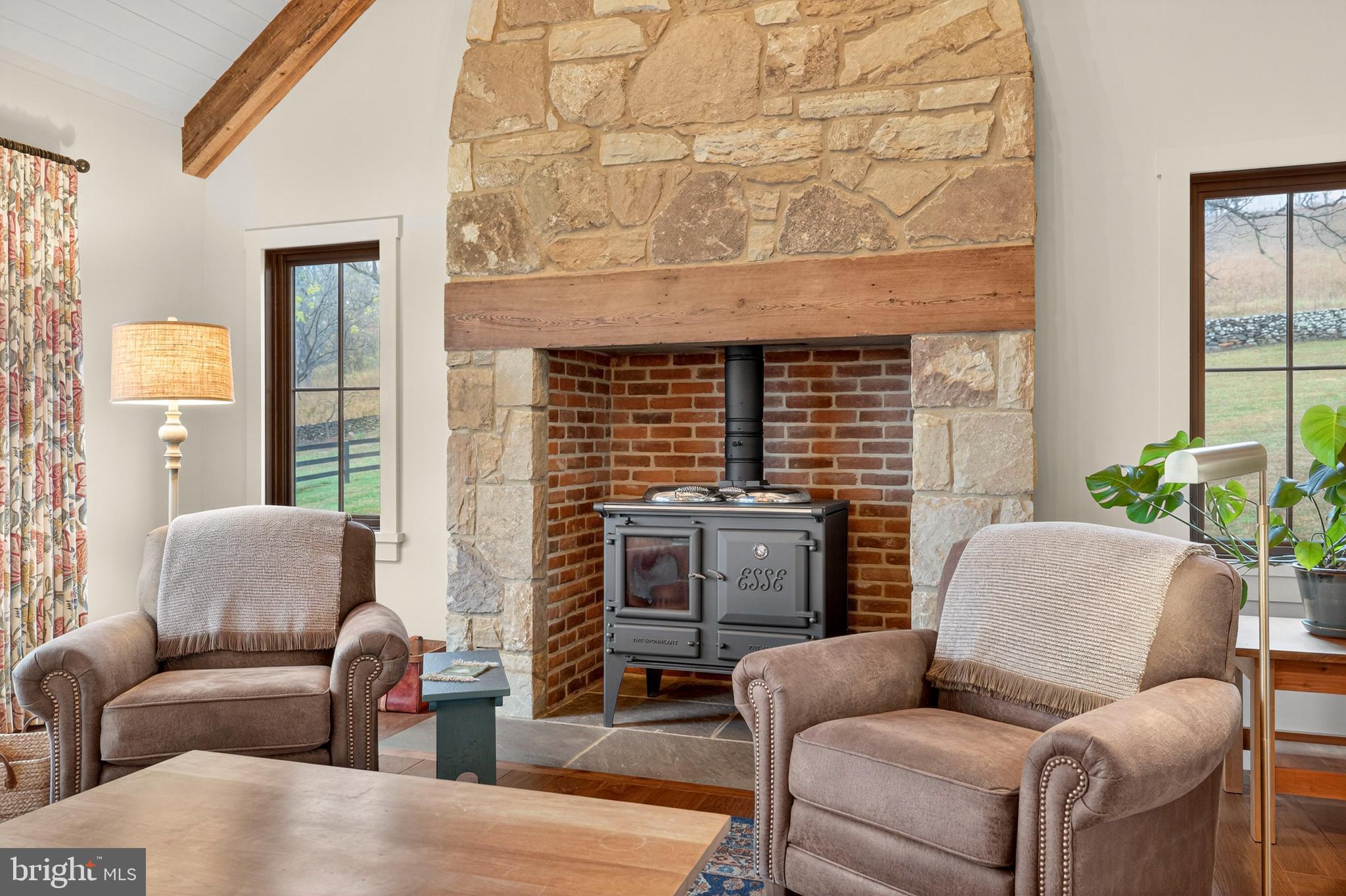 63 Riley Hollow Road Huntly, VA 22640 - Photo 8 of 92 a living room with furniture windows and a fireplace