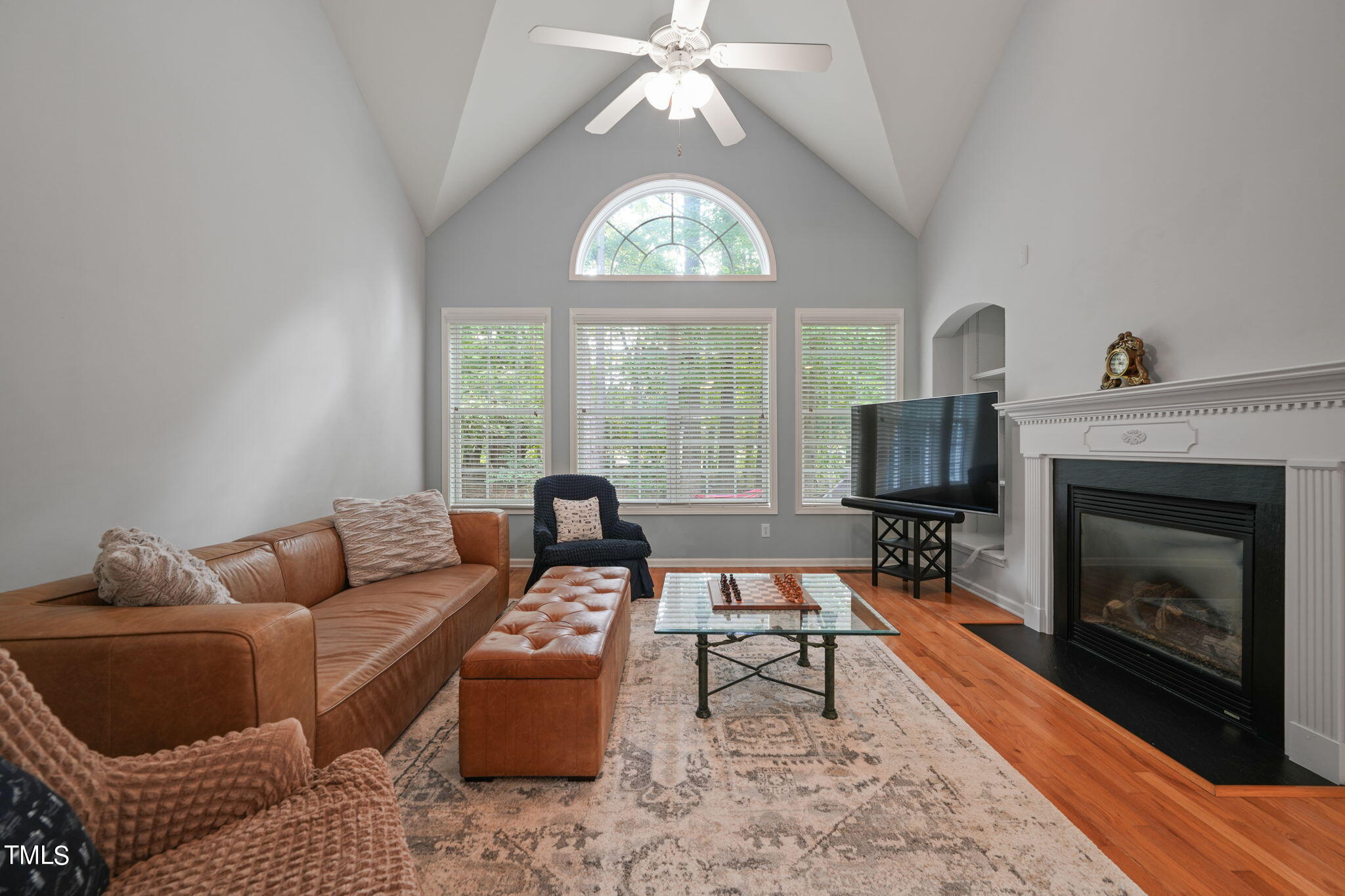 3 Piney Park Lane Durham, NC 27713 - Photo 12 of 47 a living room with furniture a fireplace and a flat screen tv