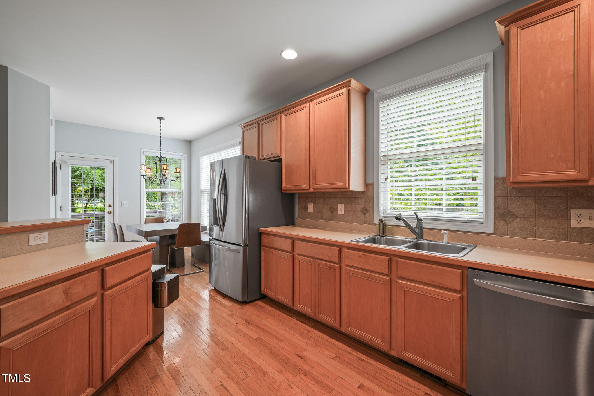 3 Piney Park Lane Durham, NC 27713 - Photo 17 of 47 a kitchen with a sink stove and refrigerator