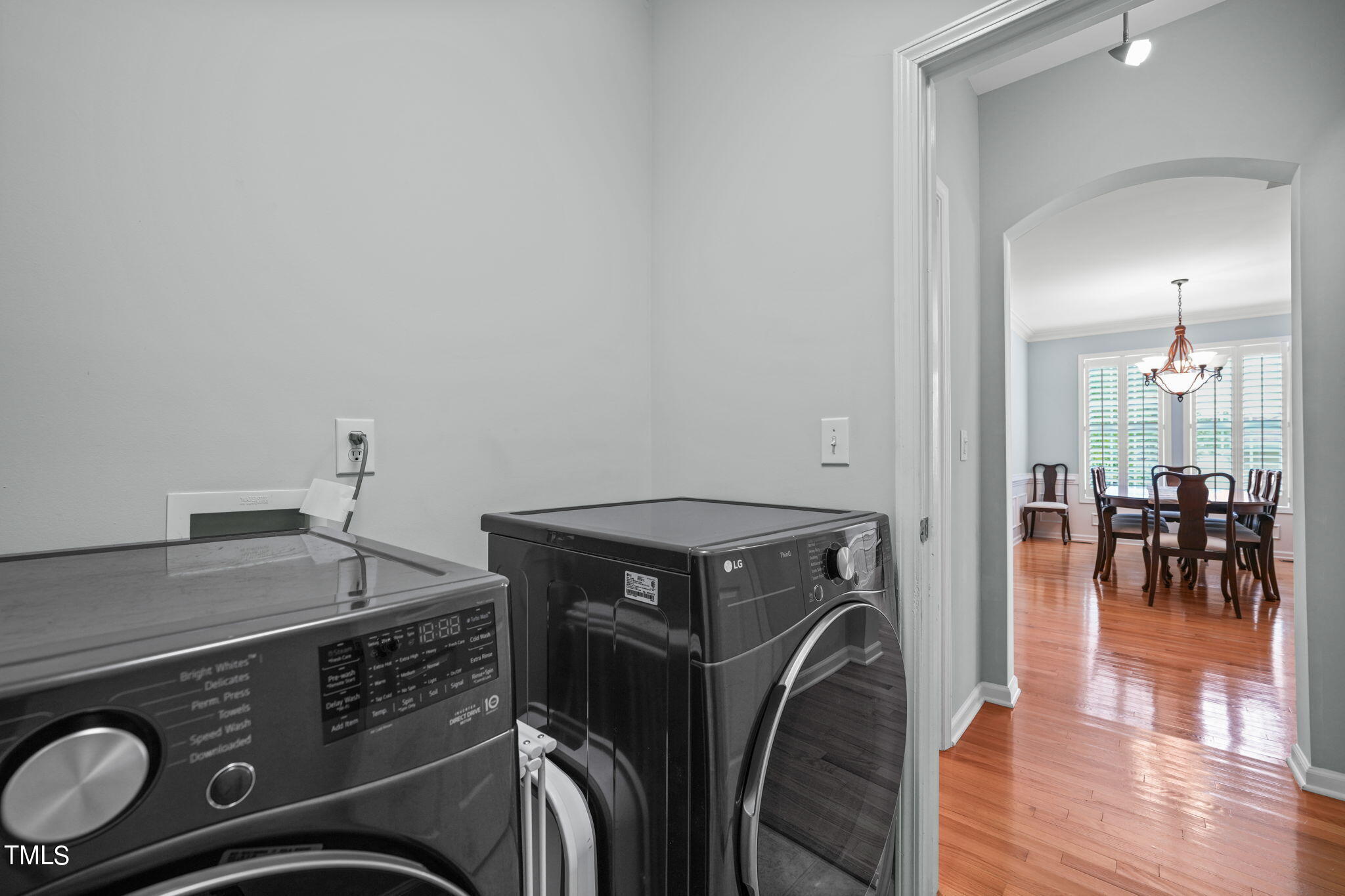 3 Piney Park Lane Durham, NC 27713 - Photo 25 of 47 a utility room with dryer washer and a view of living room
