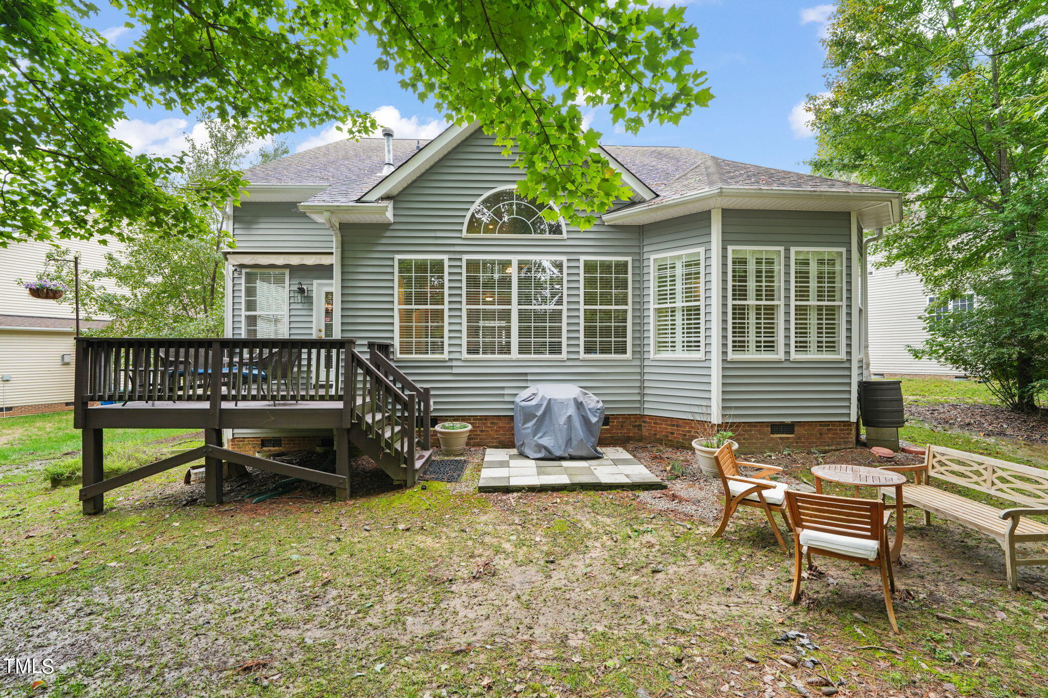 3 Piney Park Lane Durham, NC 27713 - Photo 39 of 47 a backyard of a house with barbeque oven and outdoor seating