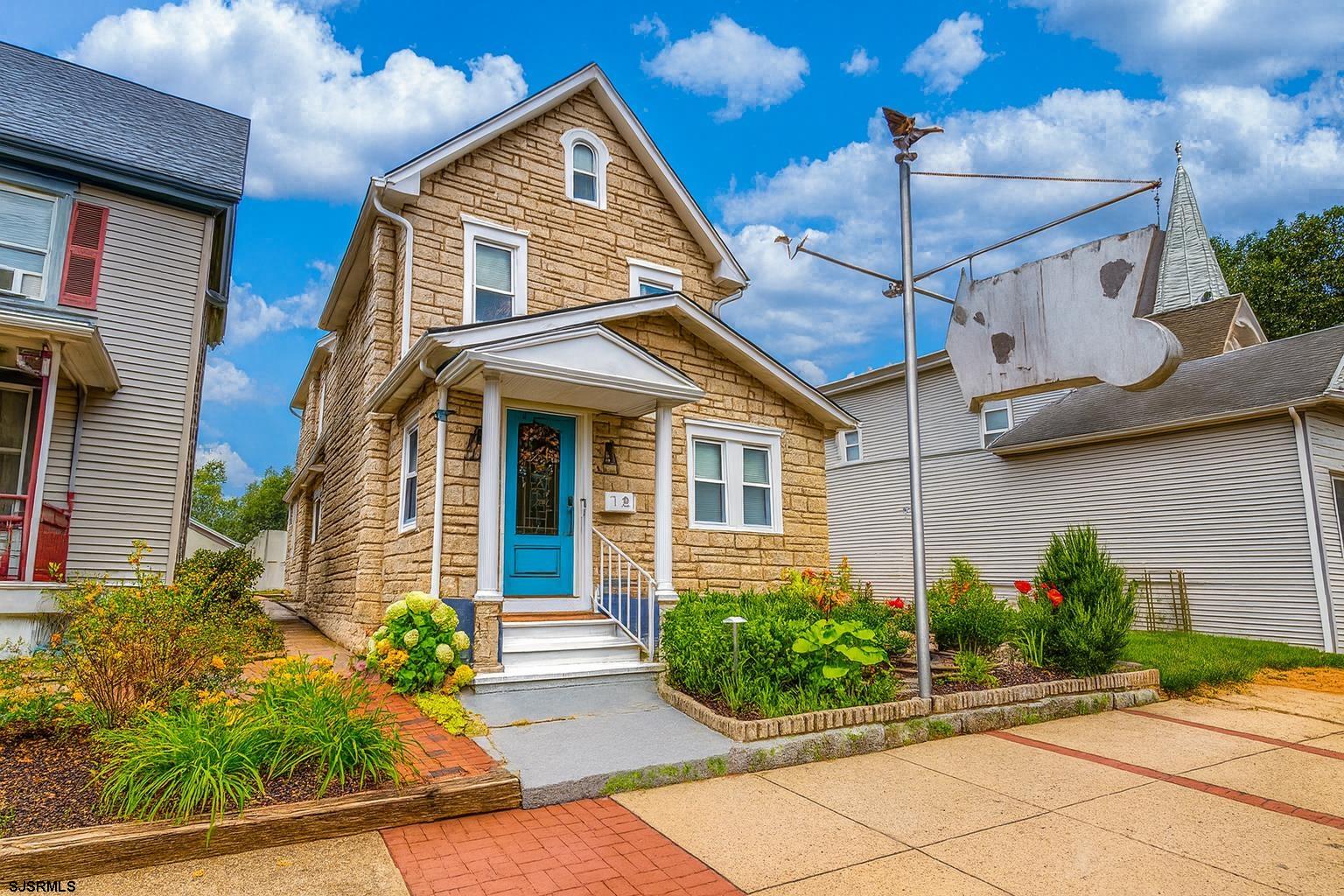 a front view of a house with garden