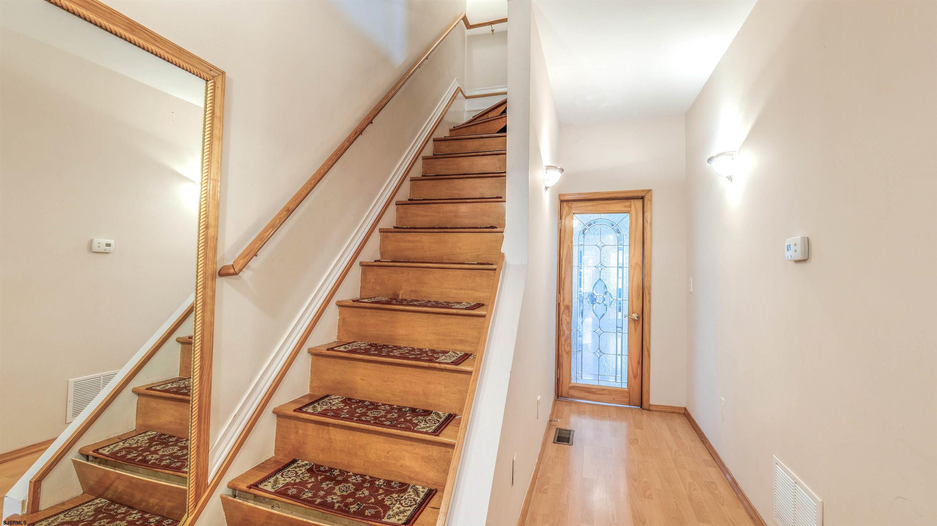 6015 Main Street Mays Landing, NJ 08330 - Photo 14 of 42 a view of a hallway with wooden floor and staircase