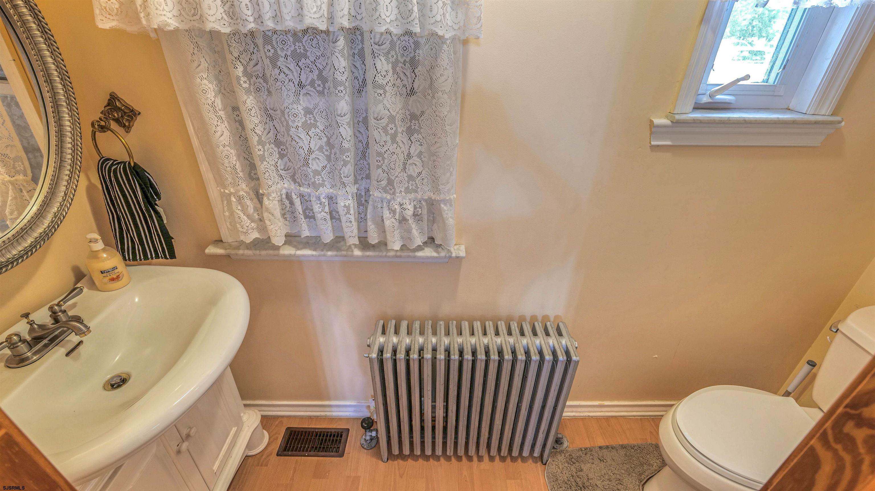 6015 Main Street Mays Landing, NJ 08330 - Photo 18 of 42 a bathroom with a sink and a mirror