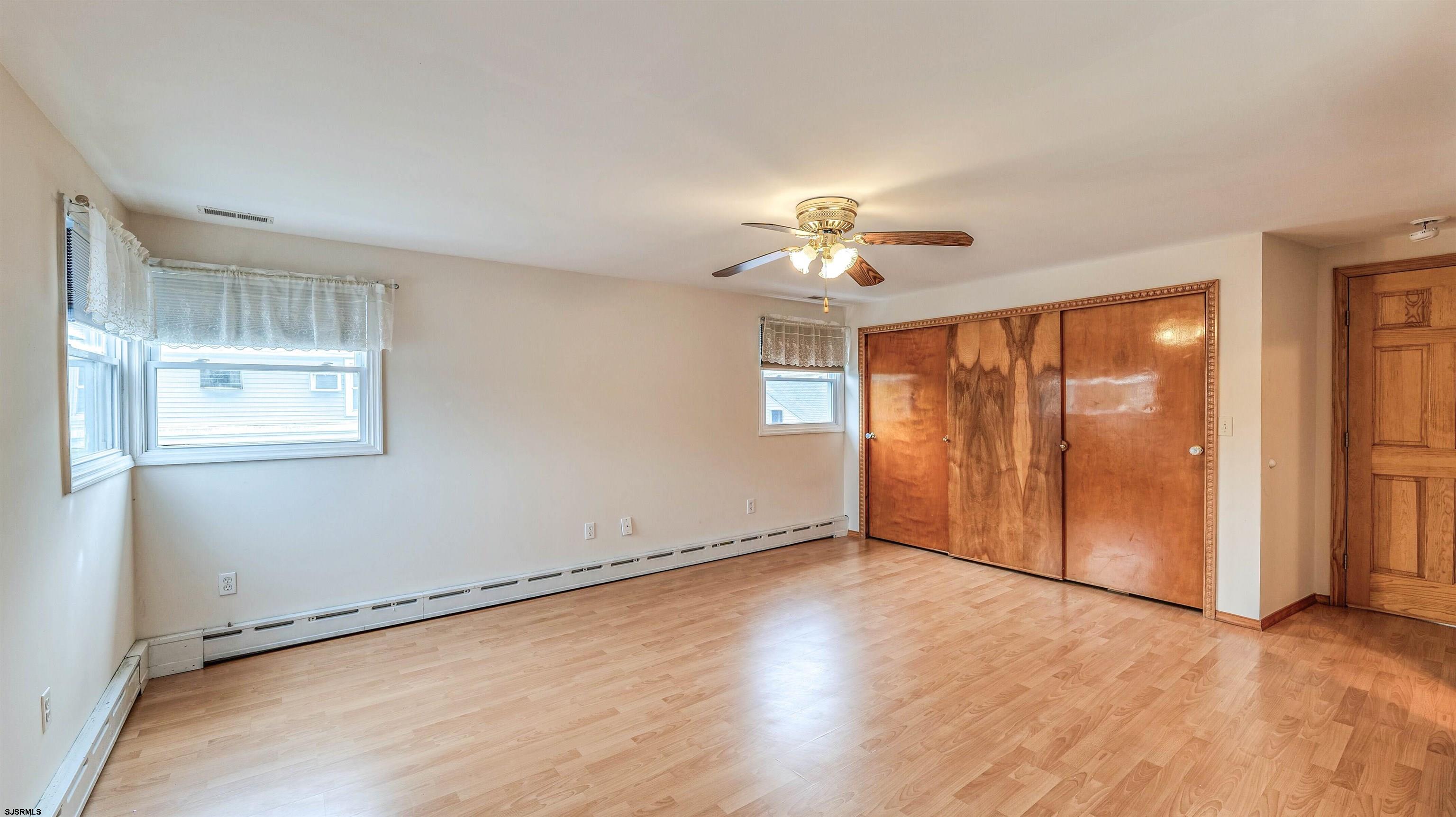 6015 Main Street Mays Landing, NJ 08330 - Photo 23 of 42 a view of an empty room with a window and wooden floor