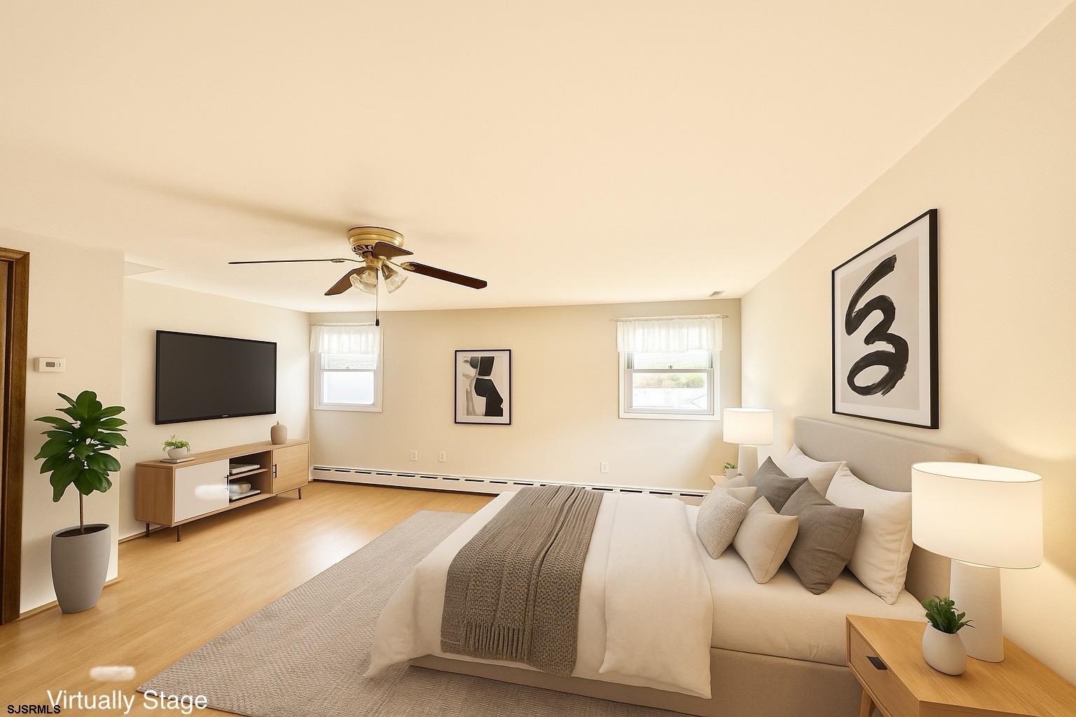6015 Main Street Mays Landing, NJ 08330 - Photo 24 of 42 a bedroom with a bed and a flat screen tv