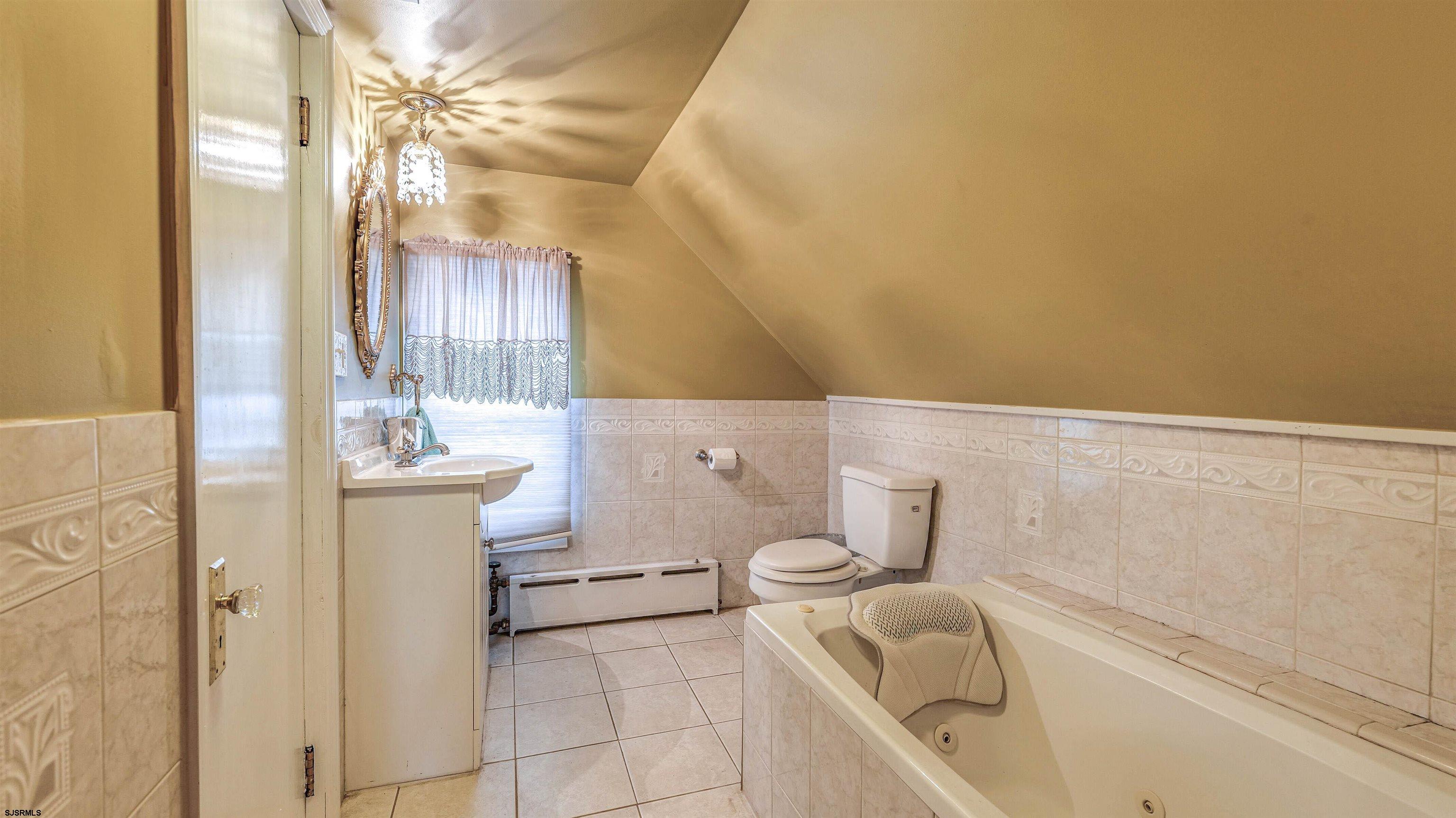 6015 Main Street Mays Landing, NJ 08330 - Photo 31 of 42 a bathroom with a sink a toilet and shower