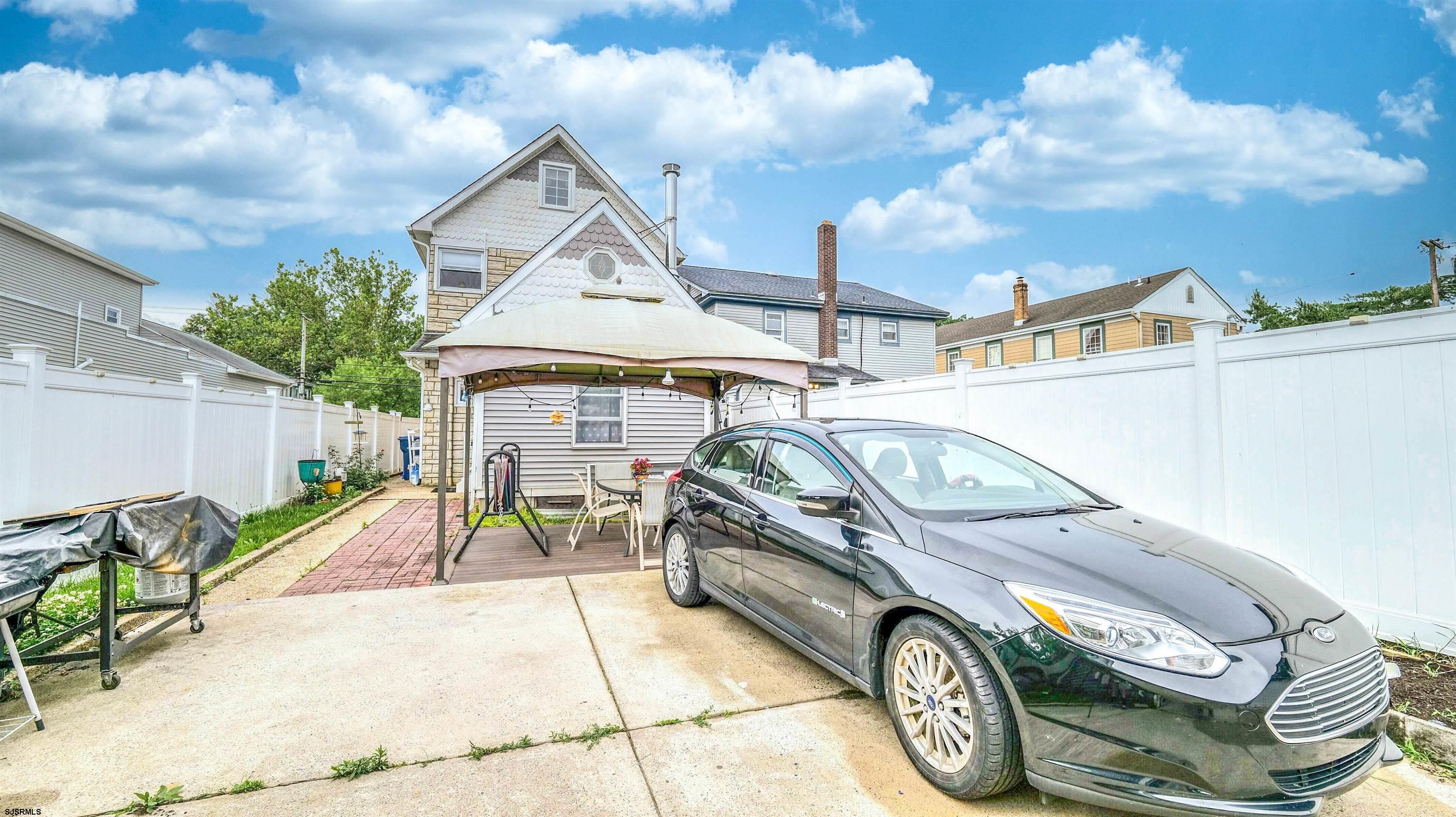 6015 Main Street Mays Landing, NJ 08330 - Photo 39 of 42 a view of a car parked in front of a house