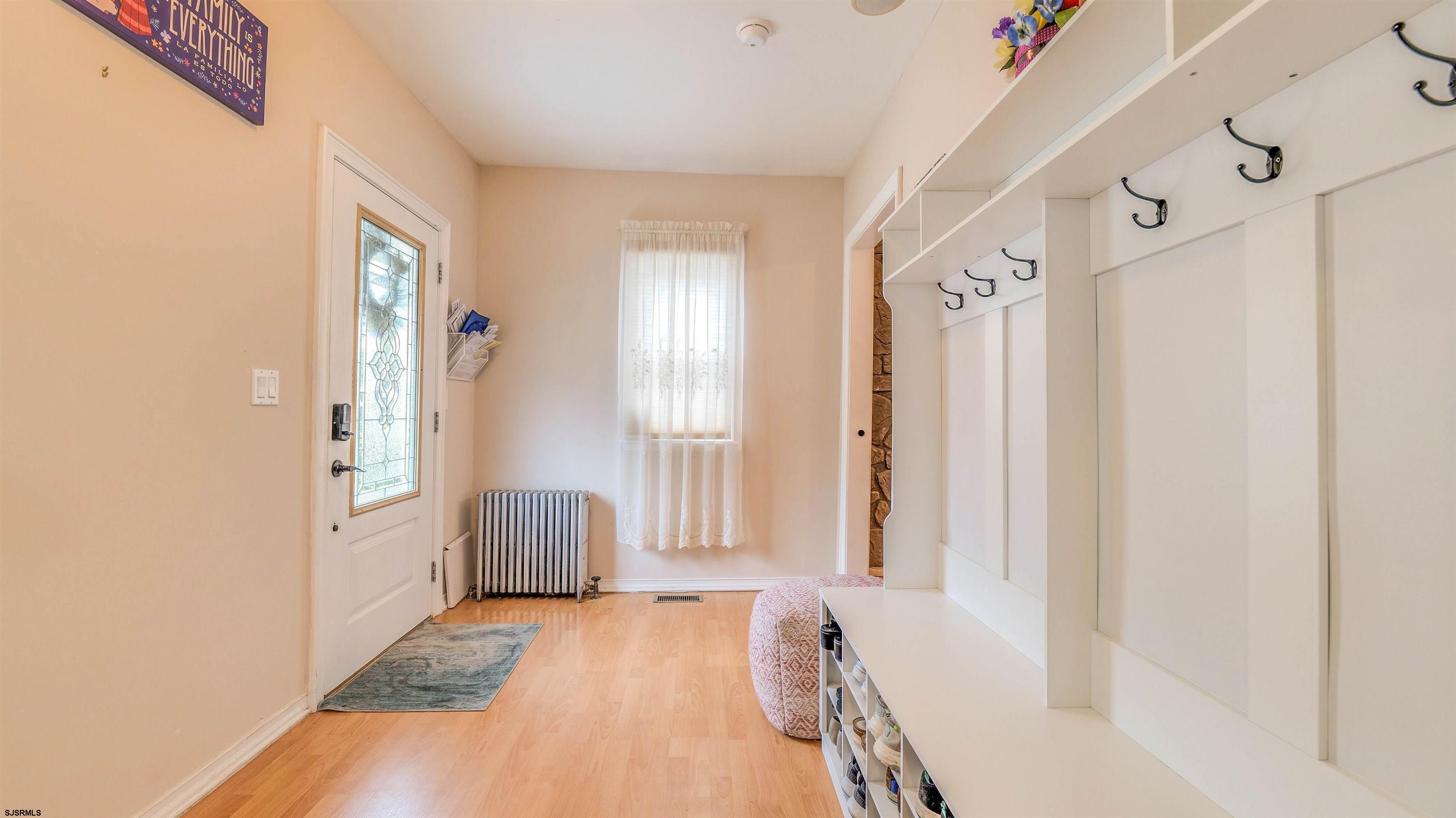6015 Main Street Mays Landing, NJ 08330 - Photo 7 of 42 a bathroom with a tub shower and window